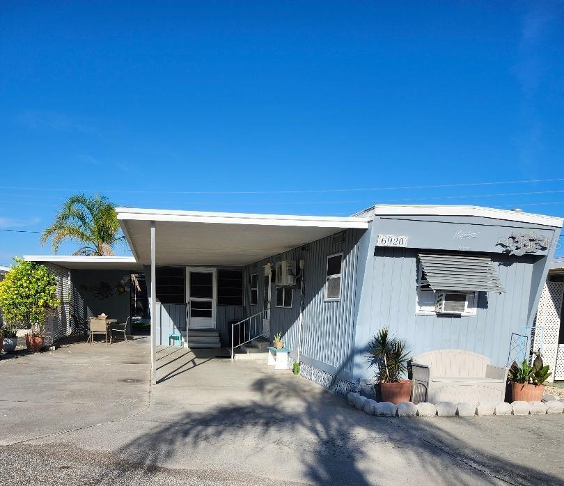 Still a lot of vintage charm in this 2 Bedroom, 1 1/2 Bath Mobile Home in the highly desired, active 55+ Trailer Estates community. Just a block to access the community pool, recreation buildings, shuffleboard, fitness center, and all the wonderful park amenities. New Mini-split A/C; new Water Heater 2024; new Roof in 2018. Vinyl plank flooring throughout. Good amount of closet space. Updated electric. 10' x 20' enclosed climate controlled porch. Washer/dryer. Storage shed. WDO treated by Aardvark (2024) with transferable contract. You own the land. Boaters have direct access to Sarasota Bay from your doorstep, or the Trailer Estates Marina. Enjoy the large, heated community pool, hot tub, gym and wood shop. The community buzzes with pickleball, shuffleboard, kayaking, horseshoes, bocce, dancing and more. A US Post Office on site. 10 minutes to Sarasota-Bradenton Int'l Airport. Convenient to shopping, restaurants, the Arts and everything in Bradenton/Sarasota. Sold AS-IS with right to inspect, no repairs or warranties. Sold furnished.