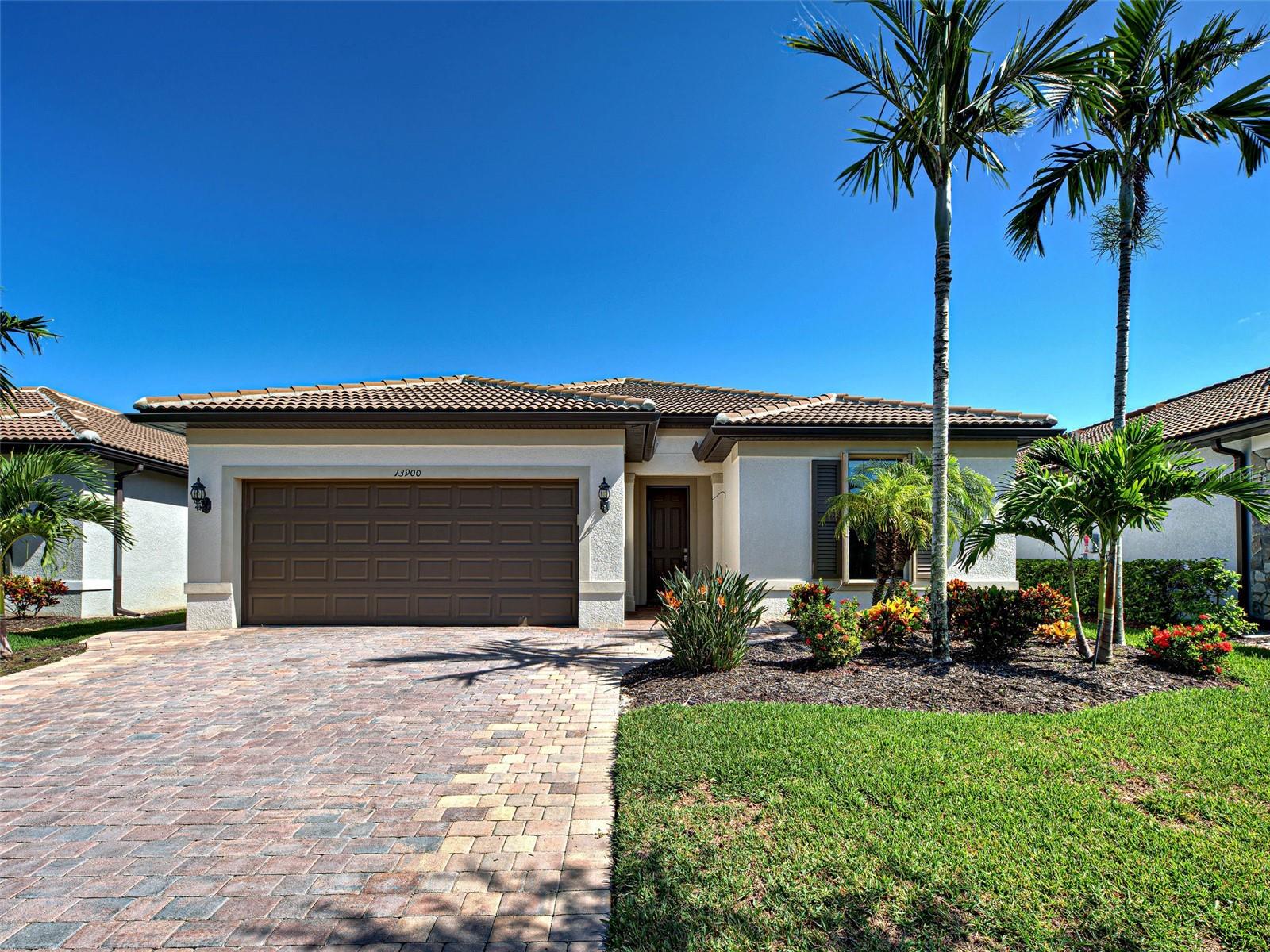 This gorgeous SUMMERWOOD model in ISLANDWALK offers an exceptional blend of luxury and comfort with thoughtful upgrades and EXPANSIVE INDOOR-OUTDOOR spaces designed for both relaxation and entertaining. The true showstopper is the OVERSIZED LANAI (40' x 34'), featuring a covered area (24.7' x 9.5'), under-air space (25' x 40'), and a CUSTOM WATERSCAPES HEATED SALTWATER lap-style POOL (16' x 35'), added in 2020, ideal for swimmers and year-round gatherings. Inside, the home features premium enhancements including a KINETICO WHOLE-HOUSE (WATER SOFTENER & FILTER), REVERSE OSMOSIS system, Hunter Douglas HONEYCOMB BLINDS on ALL windows, ADDED RECESSED LIGHTING THROUGHOUT, a RETRACTABLE SCREEN for the front door, CUSTOM SLIDER TREATMENTS, TILE flooring in main areas, and neutral tones that complement any décor.
The spacious kitchen includes a high-end GAS STOVE powered by a BURIED 120-GALLON PROPANE TANK, an uncommon upgrade in ISLANDWALK, where electric is standard. It also offers WHITE CABINETRY with pull-out drawers, a CUSTOM WALK-IN PANTRY, and generous counter space that flows into the dining area. From here, enjoy tranquil water views and abundant natural light. The open-concept OVERSIZED GREAT ROOM (31' x 12') is perfect for hosting, with two ceiling fans and triple sliders framing picturesque views of the POOL and glistening water.
The PRIMARY SUITE features a TRAY CEILING, a generous walk-in closet, a large window, and an en suite bath with DUAL VANITIES, GRANITE COUNTERS, a GLASS-ENCLOSED WALK-IN SHOWER, and space for a makeup vanity. The GUEST BEDROOM, located on the opposite side for privacy, includes a built-in closet and ceiling fan, and is adjacent to a full bath with a BATHTUB, GRAB BARS, and its own LINEN CLOSET for added storage.
A versatile FLEX ROOM with SOLID DOORS provides space for a third bedroom, home office, crafting, or exercise. The spacious, equipped LAUNDRY ROOM is well located. The immaculate GARAGE features EPOXY FLOORS, a UTILITY SINK, a bonus REFRIGERATOR, and TANDEM SPACE ideal for a workshop or golf cart storage.
The LANAI is truly the heart of the home, complete with a CEILING FAN and CUSTOM SUN SHADE to enhance comfort during warmer days, offering ample room to enjoy the FLORIDA lifestyle year-round. ACCORDION SHUTTERS THROUGHOUT THE HOME provide peace of mind during storm events. Additional improvements include a WIDENED DRIVEWAY, TWO CURB RADIUSES for easier access, and a WALKWAY TO THE water spigot. Some furniture can stay, making your move-in even easier.
Located on a tranquil street just blocks from the CLUBHOUSE, this home also benefits from future connectivity to MANASOTA BEACH ROAD (projected completion August 2026), enhancing its already excellent accessibility. Living in ISLANDWALK means enjoying a vibrant, amenity-rich community with GEOTHERMAL POOLS, HAR-TRU TENNIS COURTS, PICKLEBALL, BOCCE BALL, LAP POOLS, SPAS, PLAYGROUNDS, BASKETBALL COURTS, a DOG PARK, TWO STATE-OF-THE-ART FITNESS CENTERS, a 24-HOUR STAFFED GATE, ON-SITE HOA STAFF, OUTDOOR PAVILIONS with BBQ GRILLS, a LIBRARY, and more. GOLF CARTS are permitted throughout the community and can be taken outside if registered. Residents also enjoy exclusive access through a PRIVATE BACK GATE to DOWNTOWN WELLEN PARK, home to PUBLIX, the ATLANTA BRAVES BALLPARK, RESTAURANTS, and ENTERTAINMENT. With I-75 just four miles away, pristine GULF BEACHES, AIRPORTS, historic VENICE ISLAND, and cultural events are all within easy reach.