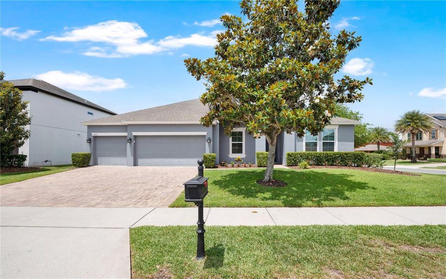 Welcome to this beautifully designed ONE-STORY, 3 Car Garage, 4 Bedroom, 3 Bathroom Home offering 2,711 Sq Ft of bright, open living space on a desirable Corner Lot with a charming front porch, perfect for enjoying Florida living. From the moment you enter, you’re greeted by a flexible layout that truly fits any lifestyle, featuring a spacious Private Office and Formal Dining Room at the front of the home. The heart of the home opens up to a stunning Kitchen and Family Room Combo, ideal for both everyday living and entertaining. The Kitchen showcases stainless steel appliances, granite countertops, stylish backsplash, and abundant cabinetry, all overlooking the main living space. Enjoy No Carpet Throughout, with Tile and New Luxury Vinyl Flooring creating a clean, modern feel. The Split Floor Plan offers privacy for guests and family, while the primary suite is a relaxing retreat with a garden tub, frameless glass shower, and generous space. Designed with functionality in mind, the home features a Large Drop Zone with Storage just off the 3-Car Garage, complete with New Epoxy Flooring, plus plenty of closet space throughout. Step outside to a backyard and covered lanai, perfect for outdoor dining, relaxing evenings, or play space for pets and family. Located in the highly desirable Johns Lake Pointe community, you’ll enjoy Resort-Style Amenities just a short walk away, including a Community Pool, Clubhouse, Fitness Center, Yoga Room, Tennis & Pickleball Courts, and Playground. Surrounded by natural beauty and just minutes to Johns Lake, Tucker Oaks Park, Historic Downtown Winter Garden, the West Orange Trail, Winter Garden Village, and major highways - this location truly has it all. Move-in ready, beautifully maintained, and designed for today’s lifestyle, this home checks every box. Schedule your private showing today!
