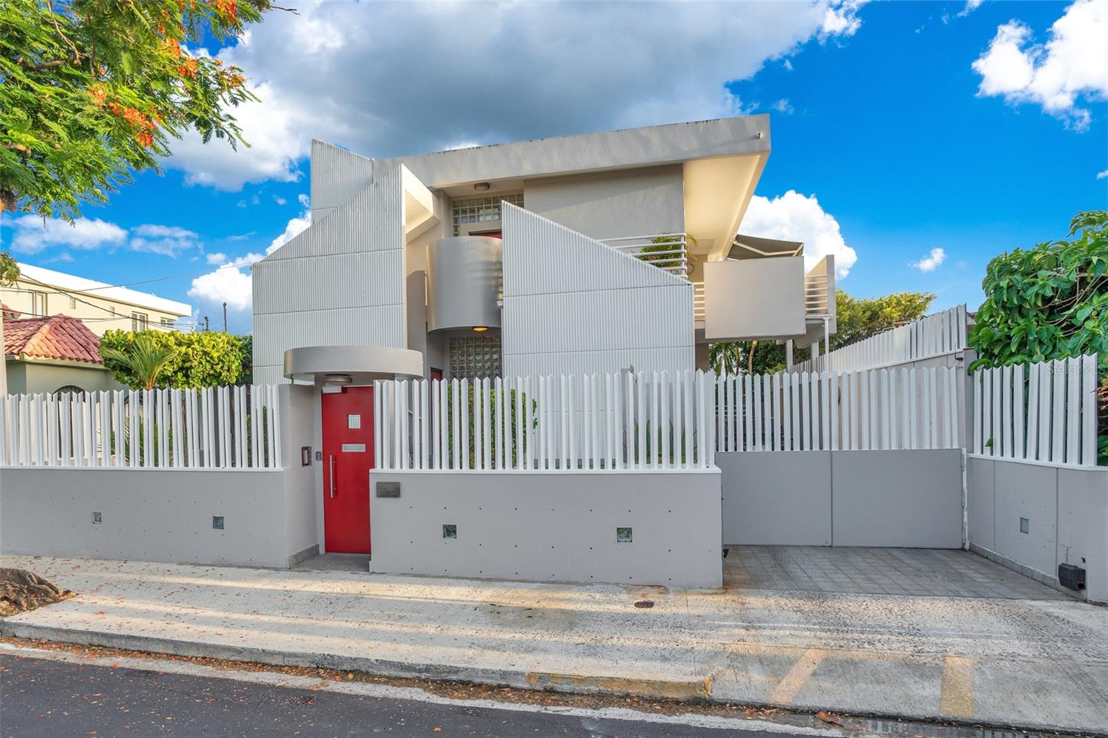 Experience luxury living just steps away from the most stunning beach in San Juan. This exceptional Ocean Park Beach House with 5-bedroom, 4.5-bathroom residence is nestled in the coveted Ocean Park neighborhood, only 100 meters from the pristine shores and a short walk to the vibrant Condado District and trendy Loiza Street, offering a variety of restaurants, boutiques, and top-notch amenities like private schools and hospitals.
Designed by a renowned Italian architect, this modern two-level home boasts 3,300 square feet of living space, ideal for a large family or two families. The first level features two spacious bedrooms, two full bathrooms, a powder room, an open-concept living-dining area, family room, and a sleek kitchen, complete with a laundry room for convenience. The second level offers three additional bedrooms, two full bathrooms, a second living-dining area, kitchen, laundry room, and an expansive terrace perfect for relaxing or entertaining.