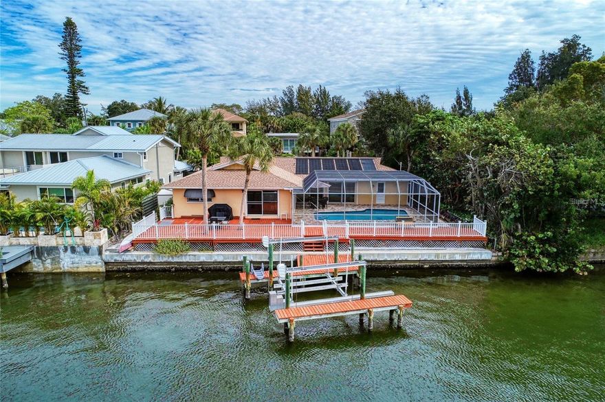 Short Term Rental-Not available January-April of 2026

Discover your perfect slice of "Island Time" at Just Breathe, a serene 3 bedroom, 2.5 bathroom home nestled directly on a peaceful Siesta Key canal. From the moment you arrive, you'll feel the world melt away as you step into this ultimate beach house getaway designed for relaxation and fun. Imagine sipping your morning coffee on the private dock, watching for playful manatees and jumping fish, or simply basking in the sunshine by your private pool. With ample outdoor space for lounging, dining, or even trying your hand at fishing, this backyard oasis is your personal paradise. Inside, the home offers a beautifully appointed, light-filled space. The primary bedroom boasts a comfortable King bed and an en-suite bathroom, while the second bedroom features a Queen bed, and the third provides flexible sleeping with two Twin/Single beds. The fully equipped kitchen is ready for family dinners, though with the vibrant Siesta Key Village near, you might prefer to explore the array of locally owned restaurants, cafes, and lively bars. The unbeatable location means you're not only steps from delicious dining and entertainment, but also just a short 3-minute drive (or a fun bike/golf cart ride, a local favorite!) to the world-famous Siesta Key Beach, consistently ranked among the best in the USA. Please note: If you are bringing a pet, there is a $250 pet fee (per pet). We encourage you to inquire about the specific pet policy applicable to your reservation for clarification, including how and when the pet fee will be collected.