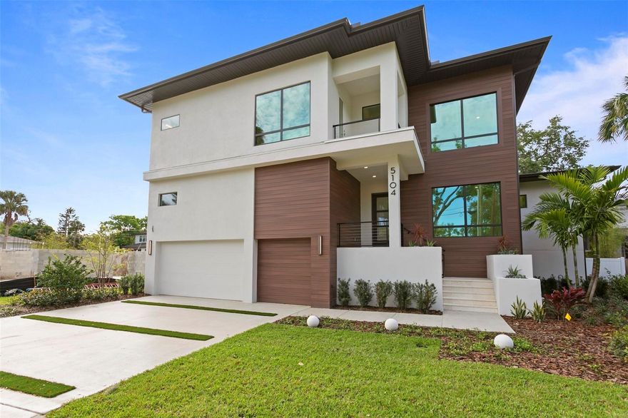 Brand new contemporary pool home in the sought-after neighborhood of Beach Park by award-winning, Adobe Homes. Featuring custom designs throughout & a high attention to detail. A spacious foyer leads you into an open floor plan with 10' ceilings, hurricane-impact windows, and smooth drywall. The main floor includes an office/study with an adjacent pool bath, an elegant custom wine room with LED backdrop lighting and a beautiful glass encasement/seamless glass doors, a built-in elevator shaft for future needs, a mudroom, a gourmet kitchen with butler’s pantry, Wolf/Subzero appliances, wine fridge, & quartz countertops. The first floor also features a large guest suite with an en-suite bath, a dining area, and a great room, plus access to the heated saltwater pool with a paved lanai, pool bath, and outdoor kitchen. Wide plank beautiful wood flooring throughout all main living spaces. Upstairs, you will find the spacious owner's suite along with 3 other bedrooms, a bonus room & a full laundry room. The primary bath features a spa-like wet room with a contemporary rectangular tub, double vanities & a make-up area. Vinyl fencing encloses the backyard for pets and friends. Upgraded landscaping. Epoxy floors in the three-car garage. The home is pre-wired for audio, cameras, a whole house-generator, and an electric car charger. One-year home warranty.