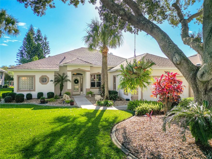 Experience refined waterfront living in this beautifully updated canal-front residence with a private boathouse offering direct boating access to Lake Griffin and the chain of lakes. Thoughtfully designed for both comfort and lifestyle, the home features an enclosed patio seamlessly connected to the main HVAC system, providing approximately 465 square feet of additional heated and cooled living space, ideal for entertaining, relaxing, or enjoying peaceful water views year-round.  In addition, the property offers a separate screened-in patio with pavers, providing approximately 390 square feet of outdoor living space, perfect for enjoying Florida breezes, morning coffee, or evening relaxation while overlooking the canal. The home showcases two fully remodeled bathrooms (2018) with granite countertops and tasteful finishes, while the kitchen is appointed with granite countertops, an extra-large pantry, and a new dishwasher (2024), blending elegance with everyday functionality. The primary suite offers a tray ceiling, and the secondary bedrooms feature generous closet space for enhanced comfort.
Notable upgrades include a roof replaced in 2018, an A/C system installed in 2021, fresh interior paint throughout, a front-load washer and dryer, and an oversized tandem garage providing exceptional storage and flexibility. Golf Cart included with the home!!! Outdoors, enjoy tranquil canal views and effortless water access leading directly to Lake Griffin and the chain of lakes—ideal for boating and embracing Florida’s waterfront lifestyle.
This move-in-ready property presents a rare opportunity to own a canal-front home with luxury finishes, multiple expanded living spaces, and direct lake access.