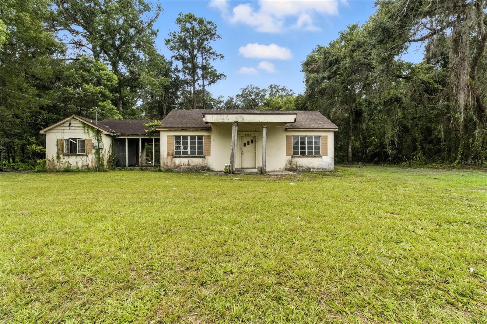 Attention investors and flippers! This 2 bed, 1 bath block fixer upper with a 1-car garage is sitting on half an acre of main road magic. It’s cash only and full of flip potential—bring your vision!