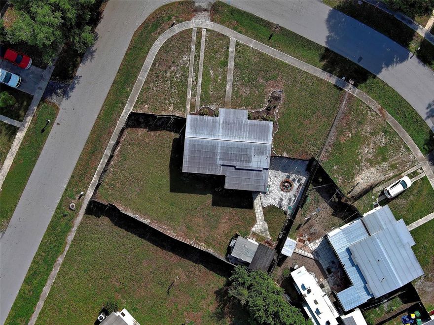 One or more photo(s) has been virtually staged. Welcome to 3101 Whiting Lane in Port Charlotte, Florida—a charming and practical property with unique advantages for the right buyer. This 2-bedroom, 1-bathroom home offers 946 square feet of comfortable living space and sits on a spacious corner lot that truly sets it apart.

Perfect for someone who needs room for work vehicles or equipment, the property features a large, fully fenced yard with easy access and ample space for parking trailers, trucks, or other vehicles securely on-site. The corner lot layout adds flexibility and convenience, making it especially appealing for business owners, contractors, or anyone with extra storage needs.

Inside, the home offers a cozy and functional layout, ideal for everyday living or as an investment opportunity. Step outside to enjoy the expansive backyard, complete with a fire pit—perfect for relaxing evenings or entertaining guests. With plenty of room to customize and make your own, the outdoor space is one of this property’s standout features.

Whether you're looking for a primary residence or a property that accommodates both living and working needs, this home offers a rare combination of practicality, space, and potential.