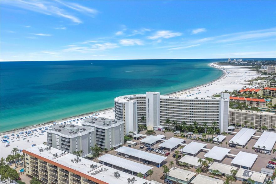 Set on the 7th floor of Crystal Sands, this fully updated residence offers a front-row position to the Gulf, with sweeping views stretching south along Crescent Beach toward Point of Rocks. Located in the sought-after “2” stack, the building sits just steps from the sand, creating a rare level of proximity to the shoreline with water views from every room.
The 2-bedroom, 2-bath split floor plan is both functional and well-balanced, offering privacy between suites while keeping the main living space open and connected. Wide-plank flooring runs throughout, leading into a light-filled living and dining area that opens seamlessly to the Gulf beyond.
A 30+ foot lanai spans the width of the residence and is accessible from both bedrooms and the main living area, creating an easy indoor-outdoor flow and a natural extension of the living space for everyday use.
The kitchen is finished with shaker-style cabinetry, quartz countertops, a center island with bar seating, and stainless appliances, designed to feel clean, current, and easy to live in.
Both bedrooms are well-proportioned with direct lanai access and calming water views, while the bathrooms have been thoughtfully updated with refined finishes, frameless glass showers, and cohesive tilework that carries the modern coastal aesthetic throughout the home.
Residents of Crystal Sands enjoy direct beach access, a Gulf-front pool, and a prime location just minutes from Siesta Key Village’s dining and shops.
With its combination of view, proximity to the sand, and updated interiors, this is one of those residences that simply works the moment you walk in.