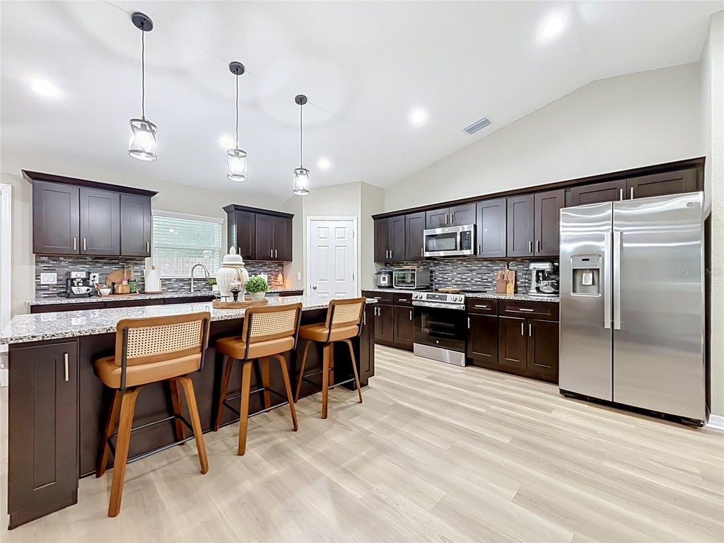 Photo of 221 Avenue P NW, Winter Haven, FL 33881 (MLS # O6449573)