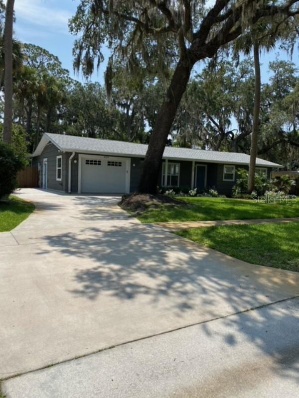 Welcome to this charming home in downtown Sanford! This updated property features three bedrooms, one bath, large great room and a den with a cozy wood-burning fireplace. The open floor plan creates a warm and inviting atmosphere, complemented by the elegant wood floors that flow seamlessly throughout the home. Situated on a generous, fenced lot, this residence offers ample space for outdoor activities and privacy. You'll also find a convenient one-car garage and a storage building, providing plenty of room for your belongings. The location of this home is truly exceptional. Just a short stroll away, you can enjoy the serene riverwalk and explore the vibrant downtown area, brimming with delightful restaurants and shops. The neighborhood is even golf cart friendly, allowing for a unique and enjoyable way to get around.