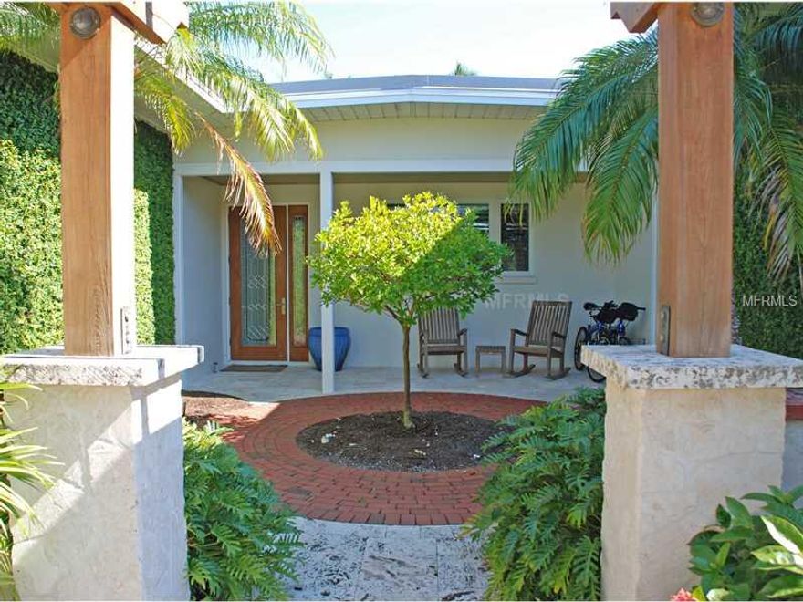 Meticulous remodel through and through from the turf lined chess board driveway and professional landscape design. To the state of the art kitchen package, to the four bedrooms, four and half baths, with the attention to detail that continues seamlessly throughout every facet of construction and added  features one would likely expect in paradise.  Generous use of space with clean lines that maximize the use of glass and light, perfect for entertaining family and friends. Outside living areas screened, open and around pool/hot tub are absolutely spectacular and the hours of tranquility and enjoyment seem endless. Perfectly situated 110' deep water frontage with 4 large open slips plus 2 covered slips with lifts provide safe harbor and bridgeless access toThe Gulf of Mexico.