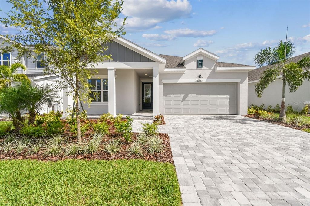 Photo of 10653 Crescent Creek Crossing, Parrish, FL 34219 (MLS # TB8421919)