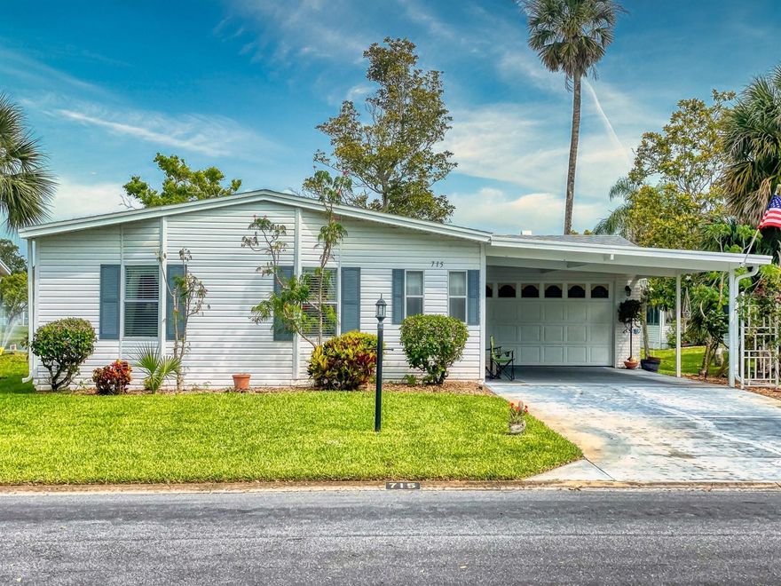 LAKE FRONT BEAUTY IN INTRACOASTAL RIVERFRONT COMMUNITY.  Terrific floor plan with cooking island.  Fabulous lake views from kitchen nook, kitchen, living room and porch (with windows and screens).  Right outside of the porch is a patio for sunbathing. Electric fireplace.  French doors to the master bedroom.  Two sinks in master bathroom.  Large home (1,869 living area) with oversized 1 car garage (with entrance from the garage) and double carport.  Roof 2/2017, A/C 6/19.

VERY ACTIVE COMMUNITY.  RESORT LIVING EVERY DAY!  A few of the amenities include:  resident intracoastal ramp, intracoastal fishing pier, fitness room overlooking the heated pool, screened hot tub, woodworking shop, tennis, pickleball, bocce, shuffleboard, Entertainment Committee, Boat and Fish Club, Women's Club, chorus, ceramics, card games including bingo, line dancing and Zumba.  

You own your own land.  Low HOA is $595/quarterly which includes platinum cable channels with 2 dedicated channels (activities and camera areas).  One outside storage either for a boat or RV is included when available. ;Water: City