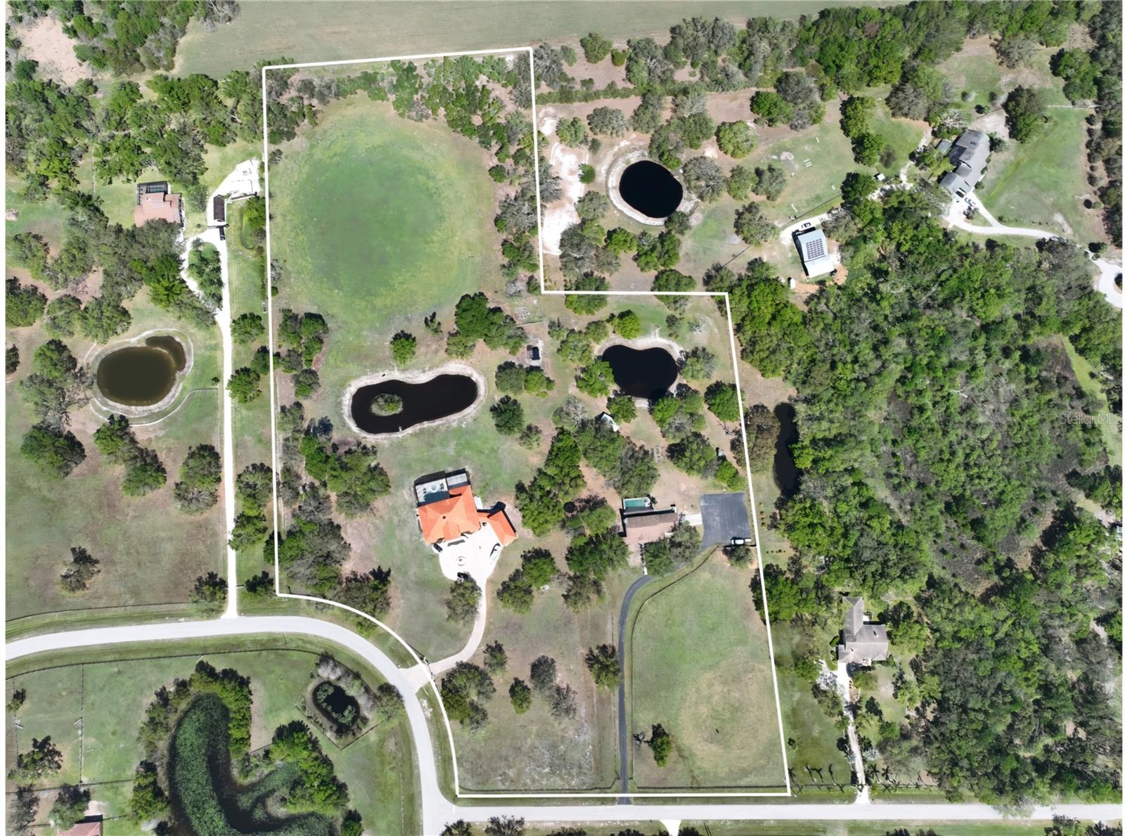 Luxury Multi-Home Family Compound on 15 Acres – Two Stunning Estates!
Welcome to an unparalleled opportunity to own a 15-acre private family compound, featuring two fully equipped estate homes—each offering luxury, space, and endless possibilities. Whether you're looking for a multi-generational retreat, an income-producing property, or an expansive homestead with room to grow, this unique offering is a rare find!
Estate 1 – The 10-Acre Homestead Mansion
This 6,232 sq. ft. masterpiece is designed for luxury living and ultimate entertainment.
6 bedrooms, 6 bathrooms, 2 dining rooms, a private office, and a massive game room.
A 750 sq. ft. mother-in-law suite with 2 bedrooms, 1 bathroom, kitchen, and living room.
An additional 1,000 sq. ft. guest house above the oversized 3-car garage.
Resort-Style Outdoor Living:
A 3,600 sq. ft. screened-in pool area with a 9-foot deep saltwater pool featuring Versace tile, Italian marble penny tiles, and a diving board.
Gas-heated pool & spa, plus a 10-person hot tub.
Two balconies: A 51-foot-long rear balcony with breathtaking views of the private lake and a charming front balcony overlooking the grand oak-lined driveway.
Private & Secure: Gated entrance, an 11,000 sq. ft. pavered driveway, and a fully fenced property with pasture areas, livestock, and a luxury chicken coop.
Expansion Potential: Zoned for additional structures such as a barn, garage, or detached living quarters.
Estate #2 – Fully Renovated 5-Acre Ranch.
This meticulously updated 5-acre ranch combines modern amenities with country charm.
Spacious, fully updated interiors designed for comfort and functionality.
Outdoor Oasis:
Large, deep screened-in pool & attached hot tub.
Private pond for added tranquility.
Outdoor BBQ/kitchen gazebo, perfect for entertaining.
Ample Space for Animals & Expansion:
2 front pastures, ideal for horses, livestock, or recreational use.
Zoned for up to 2 additional structures, allowing for a barn, garage, or extra living quarters.
Private & Secure: Gated entrance, long driveway, 2-car garage, and a large paved parking area.
The Ultimate Family Compound Awaits!
This exceptional property offers two distinct homes with a combined 15 acres of land, multiple pastures, luxurious outdoor spaces, and room to grow. Whether you're seeking a private sanctuary, a working ranch, or a multi-home retreat, this estate delivers the perfect balance of privacy, convenience, and versatility.
?? Schedule your private tour today and experience the possibilities of this one-of-a-kind compound!
