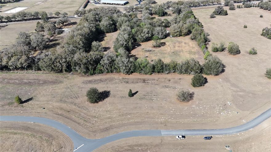 Welcome to Via Paradisus, an exclusive gated community adorned with majestic Granddaddy Oaks and tranquil, paved streets lined with streetlights. The lot consists of 3.9+/- acres. The equine-friendly neighborhood provides direct access to the stunning Florida Greenways and Trails—an outdoor enthusiast's paradise. Located just minutes from the Florida Horse Park, it's the perfect place to create your dream home or farm.

The Marjorie Harris Carr Florida Greenway is one of Florida's most cherished natural resources, offering hundreds of miles for horseback riding, mountain biking, or simply unwinding in nature.  This is your opportunity to secure a lot.