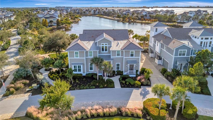 Experience elevated coastal living in the highly sought-after gated community of Harbour Isle on Anna Maria Sound. This beautifully maintained coach home offers sweeping southwest-facing lagoon and preserve views, creating the perfect backdrop for stunning sunsets and peaceful waterfront living. Featuring 3 bedrooms, 3 full bathrooms, including two private en-suites, plus a private in-home elevator, this residence combines the spacious feel of a single-family home with the ease of maintenance-free living. Designed for both comfort and entertaining, the open-concept layout showcases vaulted ceilings, plantation shutters, a bright Florida room, and a gourmet kitchen complete with an oversized island, upgraded cabinetry, stone countertops, stainless steel appliances, reverse osmosis system, and generous dining space. Additional highlights include a 2023 HVAC system and Honeywell smart thermostat for modern efficiency and peace of mind. Residents of Harbour Isle enjoy exceptional resort-style amenities, including a private Beach Club with waterfront dining, Sky Bar, and pool overlooking Anna Maria Sound, along with a fitness center, sauna, walking and biking trails, kayak launch, fire pits, 3 additional community gathering areas and pools with grilling areas. Ideally located near Anna Maria Island beaches, Neal Preserve, Robinson Preserve, and IMG Academy, this property also offers convenient access to nearby marinas, waterfront dining, and everything the Florida Gulf Coast lifestyle has to offer.
