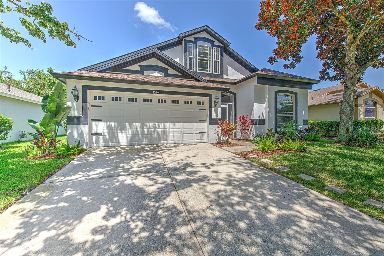 DON'T MISS THIS ONE! Beautiful 4 bedroom/2 bath home located in the gated community of Martinmeadow. A rated elementary, middle, and high schools. This beautiful Suarez built home offers 2,424 sq. ft of open living space and features 4 bedrooms, 2 baths and Bonus Room that can be used as a 5th Bedroom. The home sits on a fully fenced lot and backs up to conservation area so no backyard neighbors! The inviting double door entryway with transom window welcomes you to this lovely home. Laminate floors throughout with the exception of tile in the wet areas. The floorplan with its triple split feature, starts with bedrooms 1 and 2 to the right and bedroom 3 to the left. You will love the large formal dining area, perfect for holiday celebrations and family dinners and get togethers. The open kitchen offers a breakfast bar and eat-in area for morning gatherings and a spot to enjoy that morning cup of coffee. The kitchen has stainless appliances and plenty of counter space making the kitchen functional as well as open and spacious. The kitchen flows seamlessly into the large family room, perfect for entertaining. Large master bedroom with room for a king-sized bed and also a nice recliner or comfortable chair to sit and enjoy a good book. Large master bathroom with dual sinks, ample storage, garden tub with separate shower, loads of counter space and walk-in closet. Upstairs you will find a large bonus room with built in storage shelves and newly renovated closet. The upstairs bonus room can be used as a bedroom, playroom, office, gaming room or more! Sliding glass doors take you from the family room to the Florida room to enjoy the sunsets with your favorite evening beverage or for a workout room or just a place to relax after a long day of work. The Florida room exits to a large lanai with brick pavers and wooded conservation views. Lots of natural light flows through the large windows and gives this home a bright, open feeling. Tons of storage space, including an over-sized under the stairs storage area. Newer roof (replaced October 2021). New A/C in July 2024. Exterior of Home painted in 2023. Enjoy all of the amazing amenities of Fishhawk Ranch including, The Aquatic Club and Osprey community club houses, resort style pools, parks, tennis, shops, restaurants, skate park, dog park, and more. Call today for your appointment to see what this beautiful home and family friendly amazing community of Fishhawk has to offer!
