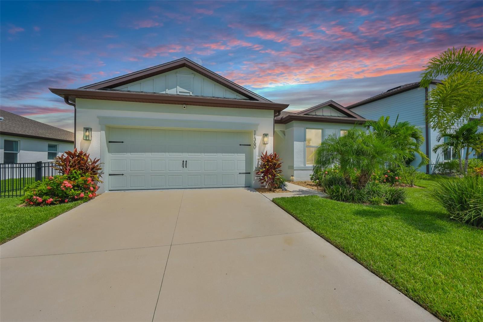 Welcome to your practically new, gorgeous Mystique model home in the highly desirable and up-and-coming community of North River Ranch in Parrish, FL. This stunning home offers 3 bedrooms, 2 bathrooms, and a versatile flex room perfect for a home office, den, or playroom. The home is kept so immaculately clean, it feels as though no one lives there. As you enter through the tall glass front door, you're immediately greeted by an open-concept layout, soaring ceilings, and plenty of natural light. The chef's kitchen is a true showstopper featuring quartz countertops, a stylish backsplash, light-colored cabinetry with soft-close drawers and pull-out shelving, a built-in convection oven and microwave, and an elegant wall-mounted range hood that completes the modern, upscale look. Whether you're hosting guests or enjoying a quiet evening at home, this kitchen and living area flow effortlessly together, making entertaining both seamless and enjoyable. No matter where you're standing or sitting in this home, you can't help but notice the serene conservation views in the backyard with no rear neighbors, just lush nature, the setting is peaceful and private. Speaking of neighbors, this home sits on a premium lot due to the size and location (50 ft. lot) with no front neighbors, offering added privacy and an open, spacious feel. With no homes directly across the street and a peaceful conservation area behind, you're truly surrounded by nature and tranquility making this one of the most desirable lots in the community. Enjoy Florida living from your screened-in lanai, or let your kids or fur babies play safely in the tastefully fenced-in yard. North River Ranch is a vibrant, active community offering resort-style pools, plunge slide, two fitness centers, playgrounds, walking and biking trails, bike share stations, dog parks, and so much more. Conveniently located near the new NRR HCA Hospital, top-rated schools, grocery stores, dining, and entertainment options - everything you need is just minutes away.