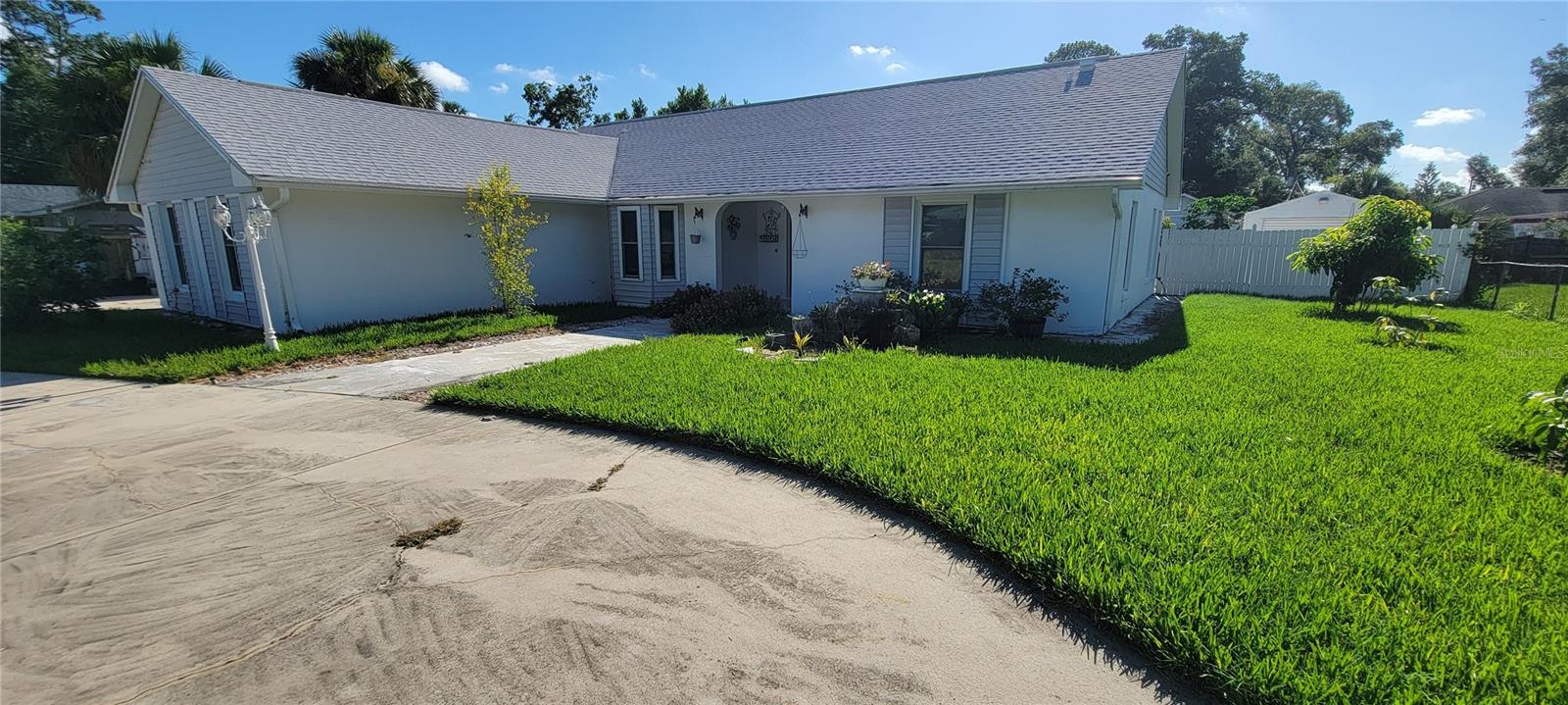 This beautiful 3-bedroom, 2-bathroom home sits on a quiet paved road but is located in the heart of Altamonte Springs. The property features an updated kitchen and bathrooms with Modern finishes and fixtures throughout. A spacious Florida room that's perfect for relaxing and enjoying the view of the various fruit trees throughout the property and a wonderful koi fishpond to enjoy. A huge indoor laundry room gives plenty of space for all your laundry needs. The home also includes a two-car garage with ample parking and storage space. and a split and open floor plan that's ideal for family living and entertaining. Convenience of the home include closeness to I-4, 429, many restaurants, shopping centers, and beautiful Wekiva Springs State Park. With freedom from hoa restrictions, enjoy the tranquility of your surroundings while being near all the amenities Altamonte Springs has to offer. Call now!