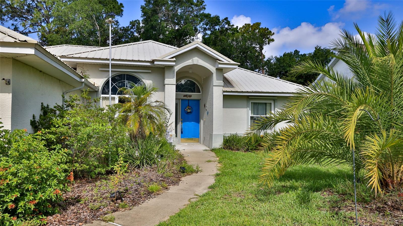 Short Sale. Searching for a home in one of the top-rated school districts—just minutes from Spruce Creek High School? This 3-bedroom, 2-bath concrete block home with a split floor plan offers both comfort and convenience. The spacious Great Room, with its soaring 10-foot ceilings, creates an open and inviting atmosphere—perfect for relaxing or entertaining. Enjoy meals in the formal dining room, or take advantage of the bright, efficient kitchen, which features ample counter space, abundant storage, and a sunny breakfast nook. The split-bedroom layout provides privacy and space for everyone, while the expansive 25’ x 10’ enclosed patio overlooks a generous backyard—ideal for enjoying Florida’s sunshine year-round. The indoor laundry/utility room adds everyday convenience for busy families. Retreat to the serene master bedroom, where comfort meets style. This home is nestled in a quiet, family-friendly neighborhood that is the ideal spot for raising a family, with no HOA, and is just minutes from I-95, beautiful beaches, shopping, dining, churches, and more. There are no warranties expressed or implied. All measurements are approximate. Square footage received from tax rolls. All information recorded in the MLS intended to be accurate but cannot be guaranteed.