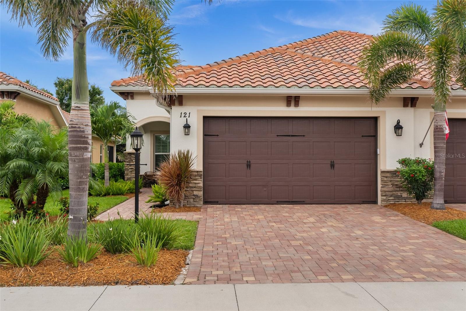 Welcome to your dream villa in the desirable Cassata Place community—just 3 miles from charming Downtown Venice and the beautiful shores of Venice Beach!
This 3-years-new home offers modern comfort, quality construction and elegant design. Featuring full impact doors and windows, a tile roof, and gutters, it’s built with durability and peace of mind in mind. The open floor plan flows effortlessly from room to room, with sliding doors leading out to a covered and screened lanai—perfect for relaxing or entertaining.
The spacious kitchen includes a pantry and features stainless steel appliances, stone countertops and white cabinets. The primary suite features two walk-in closets and a private bath retreat. A bonus room provides the flexibility for a home office, den or hobby space.
Additional highlights include a laundry room with closet space, ceiling fans in all bedrooms and the living room and plantation shutters. Finally, the 2-car garage features epoxy flooring as well as a utility sink and the driveway is complete with pavers.
Cassata Place residents enjoy access to a heated community pool that’s 5 feet deep—ideal for a refreshing dip year-round. Don’t miss this opportunity to live just minutes from world-class beaches, shopping, dining, and everything Venice has to offer!