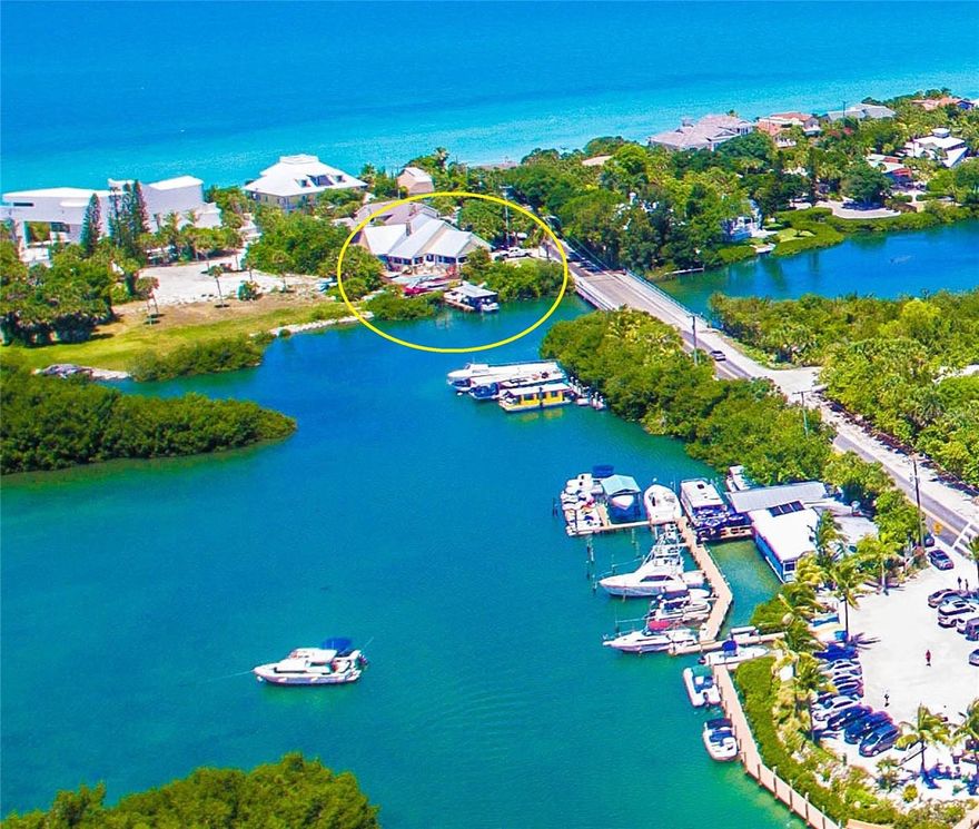 BACK ON MARKET. CASEY KEY HOME RUN INVESTMENT! MOTIVATED SELLERS HAVE REDUCED. STORM RESISTANT Waterfront Residence on Casey Key, one of the most exclusive barrier islands on Florida’s West Coast!  Looking for a waterfront residence MOVE-IN READY, with a deep-water dock, completely unaffected by the recent storms; & located on a magical Island that has no high rises, no traffic jams, exclusivity, resident-owned beaches, privacy, great medical, dining, and shopping, all extremely convenient? This Casey Key estate with over 4300 square feet of living space offers a rare combination of privacy & location, with stunning views of Little Sarasota Bay, a 10-foot-wide deeded easement to a pristine large beach & the Gulf of Mexico, where you can enjoy miles of quiet shoreline. Designed to capture the essence of Coastal Florida living, the home features a light & airy Open Concept Living floor plan, 18-foot vaulted Epi wood beam ceilings, double-sided stone fireplace, travertine marble floors, custom stonework, 4 bedrooms & 3.5 bathrooms. Enjoy 180 degree waterfront views while overlooking the pool, spill-over spa, & newly added Epi wood deck. The expansive master suite located on the ground floor boasts breathtaking views of Blackburn Bay, large walk-in closets, & jetted garden tub. The two guest rooms, located on the next level up, are spacious & bright with large walk-in closets, each opening to a cozy shared balcony. A boater’s dream, with a steel-roofed covered boat slip with 16K pound lift & a deep-water wet slip. Oversized 2-car garage, plus two driveways with parking for up to 10 additional vehicles, a motorhome, & extra boat or trailer parking. Additionally, another remarkable & rare bonus on the lower level, is the climate controlled 3,500 plus square feet of storage space. Significant updates, totaling over $500,000, include full re-plumbing, three new air conditioning units, a new pool deck and refinished pool with all-new equipment, and a steel roof—all completed in 2020. Embracing the island lifestyle, residents relish the warm Gulf breezes by day and breathtaking sunsets at dusk. A favorite transportation choice by residents is often Golf Carts with easy access to nearby tiki bars, restaurants, grocery store, pharmacy and more. The property's strategic location just west of the historic Blackburn Point bridge facilitates excellent proximity to the mainland with top-rated schools, fine dining establishments, Downtown Sarasota, St Armand’s Circle, The Island of Venice, and world-class medical facilities. Notably, Casey Key is the ONLY barrier island in the region with an expressway from Tamiami Trail to I75 creating easy access to all area international airports, plus private air travel options within ten minutes. The allure of this locale is undeniable, as Casey Key Road was recently acclaimed as the most coveted street address nationwide, underscoring the unparalleled status of this magical barrier island. Don't miss the opportunity to own this exclusive Casey Key residence.