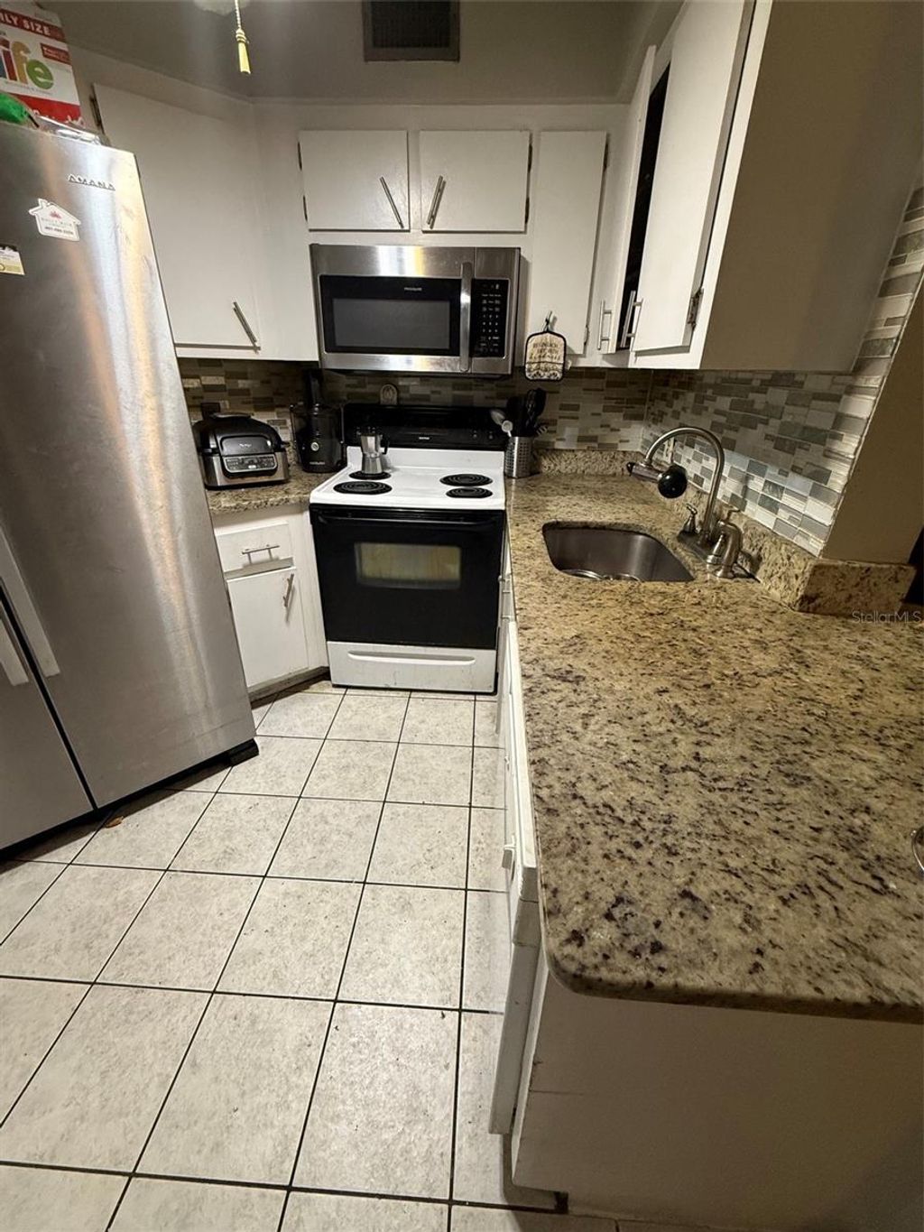 Photo of 3940 Atrium Drive #L7, Orlando, FL 32822 (MLS # O6410204)