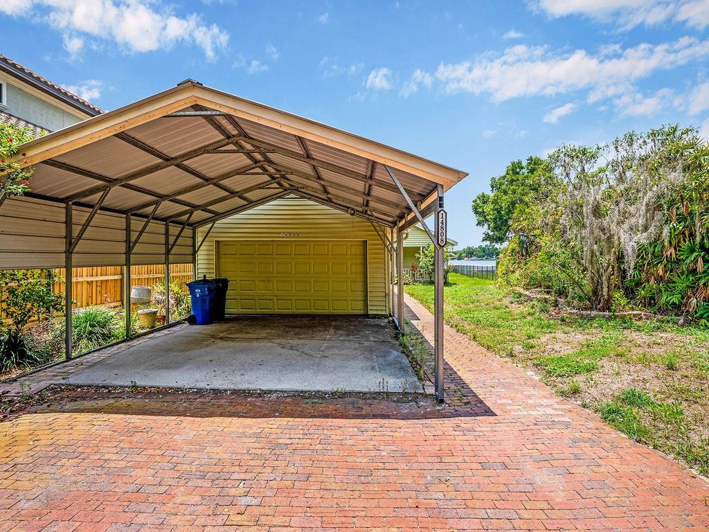 Photo of 14808 Lake Magdalene Circle, Tampa, FL 33613 (MLS # TB8393627)