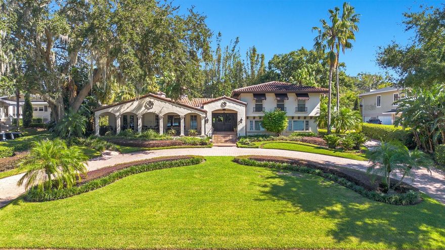 Discover this exquisite lakefront property located in the heart of Winter Park! Nestled on over an acre with more than 125 feet of water frontage, this home offers breathtaking views and absolutely stunning sunsets. As you step through the front door, you’re greeted by captivating lake views that flow from front to back. The spacious foyer leads to a charming living room, complete with a brick wood-burning fireplace. This area seamlessly transitions into the Florida room, an entertainer’s paradise featuring a wet bar, seating area and pool table, with easy access to a full bathroom that is equipped with a steamer shower. Open the French doors to reveal a tranquil outdoor oasis, where mature landscaping ensures privacy for the heated spa, creating a resort-like atmosphere in your own backyard. The heart of the home is a state-of-the-art chef's kitchen, boasting a large island, oversized GE refrigerator, Thermador dual ovens, elegant custom cabinetry, granite countertops, and a cozy breakfast nook. The spacious formal dining and living rooms offer beautiful lake views and lead out to a tranquil front terrace. For those who work from home, a private office on the main floor with a lake view provides an ideal and serene workspace. The large family room is perfect for everyday gatherings and is conveniently located next to a half bath. Upstairs, the primary suite overlooks the lake and features a walk-in closet and ensuite bathroom with a standalone Jacuzzi tub and separate shower. Two additional bedrooms share a full bath, while a generous fourth bedroom serves as a secondary primary suite with its own ensuite and walk-in closet. The property includes a paver circular driveway leading to a side-entry two-car garage.  Cross the brick paved road to a sprawling lakefront lawn, leading to a private boat dock with a lift, perfect for enjoying all the water activities. Located on Lake Sue, a private ski lake, this home is just minutes from Park Avenue's shopping and dining, Downtown Orlando, Baldwin Park, playgrounds, parks and excellent public schools. Don’t miss the opportunity to make this stunning lakefront home your own!