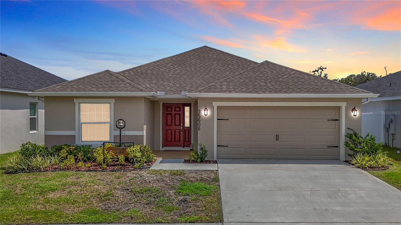 Welcome to modern living in the heart of the Chapel Creek community in Pasco County. Built in 2023 by Highland Homes, this nearly new 4-bedroom, 2-bath residence features the highly sought-after Serendipity floor plan—offering over 2,000 square feet of smart, stylish, and functional living space. Step inside to an open-concept layout that blends the kitchen, living, and dining areas—ideal for everyday life, entertaining guests, or simply staying connected. The kitchen is a standout with QUARTZ COUNTERTOPS, stainless steel appliances, contemporary cabinetry, and an OVERSIZED central island perfect for gathering with family and friends. And unlike many newer homes where the pantry is an afterthought, this one delivers: a MASSIVE WALK-IN PANTRY that’s ready to take on your biggest hauls from Costco, Sam’s Club, AND BJ’s—yes, all at once. The spacious primary suite features a walk-in closet and an en-suite bath with DUAL VANITIES and a walk-in shower, creating a private retreat after a long day. Three additional bedrooms offer flexibility for a home office, guest space, fitness room, or whatever your lifestyle demands. Situated on a PREMIUM WATER VIEW lot, you’ll enjoy peaceful mornings and relaxing evenings on the screened-in lanai, taking in TRANQUIL VIEWS of the pond and surrounding wildlife. Designed with today’s homeowner in mind, this home includes energy-efficient construction, modern finishes, and low-maintenance materials inside and out. The Chapel Creek community offers a QUIET setting while remaining just minutes from local shops, restaurants, medical facilities, and key roadways like SR-54, US-301, and I-75—making your daily commute or weekend plans a breeze. If you're looking for a move-in-ready home that combines thoughtful design, flexible space, and lifestyle-friendly features, 35606 Bellington Boulevard checks ALL the boxes.
