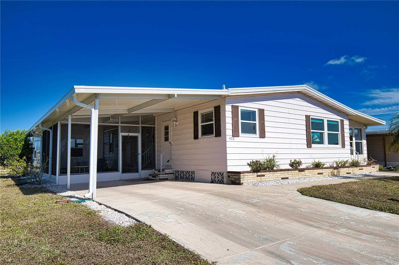 This is your chance to enjoy the Florida dream in a vibrant 55+ community! This charming home features an open concept kitchen/dining/living room area that is perfect for entertaining guests. The living room opens to an oversized Florida Room with 3 walls of windows for lots of natural light. The primary bedroom is extremely spacious with an ensuite bath that offers a generous walk-in closet and a walk-in shower . Your overnight guests will be very comfortable in the secondary bedroom which boasts 2 wall closets. The guest bath is also generous in size and right across the hall for added convenience. New Shed 224. Membrane Roof 2024. New Vapor Barrier 2024. A/C 2022
La Casa boasts 974 homes nestled among a variety of native trees with spacious common grounds surrounding our eight lakes. Our lots average a generous 60' by 80'. The ultimate lifestyle on Florida’s Gulf Coast is located between Sarasota and Fort Myers and is a boater's dream with access to the Gulf of Mexico. It is convenient for shopping, sightseeing, golfing, fishing, and boating, as well as all the culture and elegance the Southwest Florida area is noted for. Residents and visitors enjoy the warmth of Southwest Florida winters in a relaxed and unhurried environment far removed from the hustle of Florida’s east coast. You’ll be surrounded by mature lush landscaping which demonstrates the utmost level of care our property receives from residents and management. La Casa may have the best pools in the area. Our crown jewel is an extremely large, 40 X 60-foot swimming pool that is kept at a perfect 87 degrees. Our smaller 20 x 40 pool is quietly nestled between the clubhouse and the Activity Building. Both pools have adjacent hot tubs which are ideal for soaking muscles that are tired from golfing or tennis. Wireless Internet (Wi-Fi) is available at the Clubhouse, Activity Building, and Recreation Hall area where these pools & spas are located, so you can catch some rays while you catch up on your email! Sound enticing? La Casa is a friendly, family community. You will be away from the hustle and bustle except when you want to be part of it. Come for a visit to this self-contained oasis and see for yourself why La Casa is the ultimate destination for both snowbirds and year-round residents!