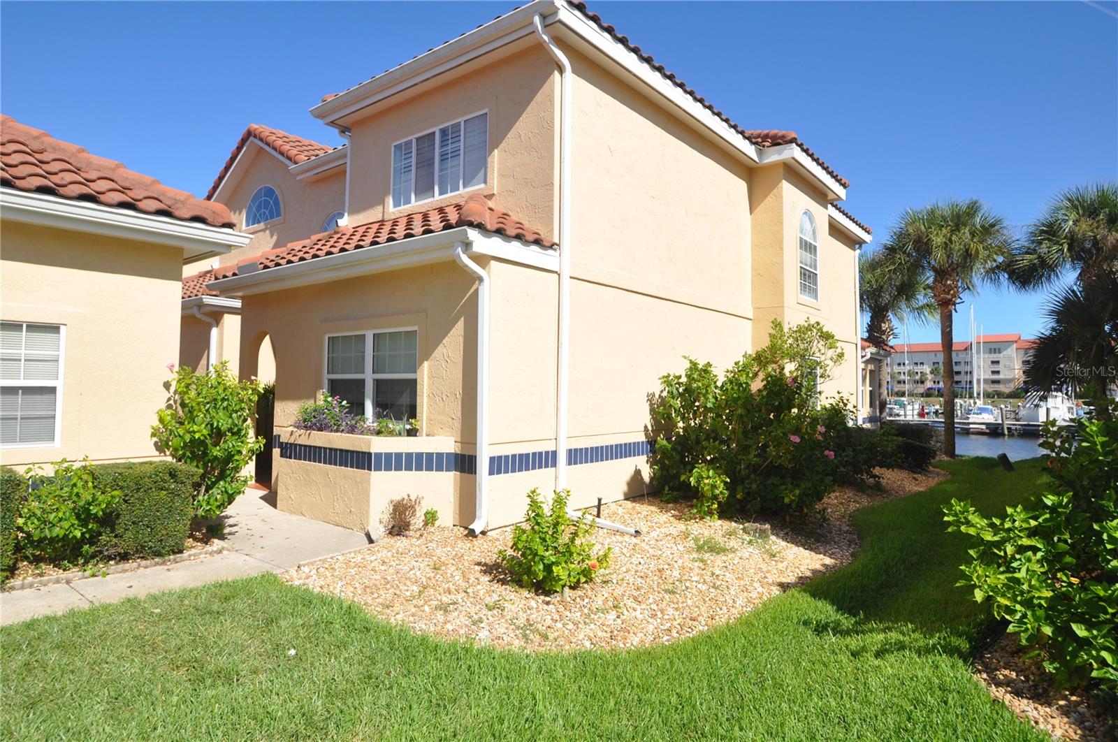 Savor the serene lifestyle at 10 Marina Point Place, nestled in the picturesque Palm Coast, FL. This stunning 2-bedroom townhouse offers 1,565 square feet of luxurious living space, perfect for those seeking a tranquil waterfront escape. Imagine waking up to breathtaking scenic views that greet you from every window, setting the tone for a peaceful day ahead. The heart of this home is its modern kitchen, boasting elegant granite countertops that provide both beauty and functionality for your culinary adventures. Enjoy two full baths, thoughtfully designed for comfort and convenience, ensuring every family member or guest feels right at home. Step outside and be enveloped by the calming ambiance of waterfront living, where gentle breezes and stunning sunsets become part of your daily routine. This townhouse is more than just a place to live; it's a gateway to a lifestyle filled with relaxation and inspiration. Take advantage of the vibrant Palm Coast community, offering a wealth of recreational activities and amenities just moments away. Whether you're seeking a permanent residence or a seasonal retreat, this property promises an unrivaled blend of comfort and elegance. Discover your new haven at 10 Marina Point Place, where every day feels like a vacation.