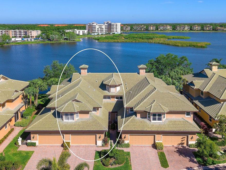 Ready for a lifestyle where you can truly have it all? Location! Fully renovated interior! And new roof in 2022! At the Moorings at Edgewater, this sensational first floor condo is the home for you! Featuring incredible renovations, high-end finishes, impressive views of Lake Uihlein and a two-car attached garage. Plus, this unit is located in one of the few communities that is truly walkable distance to Lakewood Ranch Main Street. Completely transformed in 2024, this unit exudes elegance and modern style with large format Carrara marble-look imported tile, new open flow floor plan, whole-house sound system, remote-controlled window treatments and designer light fixtures throughout the home. You’re welcomed home through the 2024 artistic front door and instantly greeted with wide views of the 160-acre Lake Uihlein. The central great room is highlighted by a custom feature wall with warm wood, lighting, sleek shelving and entertainment niche. Entertaining extends onto the private lanai through 2024 center-opening impact sliding glass doors. Enjoy evenings on your private screen enclosed and covered lanai with serene lake views. Dine alfresco lakeside or savor classy meals indoors in the formal dining space with designer light fixture. The kitchen has been thoughtfully expanded and completely renovated with cohesive design including quartz counters, custom cabinetry and drawers, glass display, integrated pantry cabinetry tower and large central island with dual waterfall edges. Chefs will adore using the top-of-the-line appliance suite with 2024 Wolf 30” induction bridge cooktop with pop-up down draft, two built-in Wolf ovens, Wolf microwave drawer, Cove dishwasher and Subzero separate refrigerator and freezer columns with cabinetry panels. Retreat to your private study equipped with custom cabinetry including file drawers, quartz counters, glass lighted display cabinetry and lighted floating shelving. Retreat to your primary wing that has been elegantly upgraded and includes 2024 impact sliders to the lanai, lake views from the moment you wake up and dual walk-in closets. The primary suite was completely redesigned for a modern lifestyle and has elegant spa-like upgrades featuring long floating vanity of custom cabinetry, thick quartz counters, linen storage tower and new walk-in shower with glass enclosure, three shower heads including a rain shower and floor-to-ceiling tile. Guests will luxuriate in their own suite outfitted with the same sophisticated finishes, roomy closet, and en-suite bathroom with floating vanity, floor-to-ceiling tile and walk-in shower with glass enclosure. Additional spaces include a convenient and beautiful powder bath and a functional mudroom entry with a wall full of custom storage. The laundry has been redesigned into a functional space with 2024 front-loading ASKO washer and dryer, modern cabinetry, quartz counters and an accent tile wall. Don’t forget your private attached 2-car garage with EV charger and epoxy floor. Peace of mind is secured with 2024 water heater, 2024 security system, 2024 impact windows, 2024 water purification system and 2024 AC unit. The Moorings at Edgewater offers unparalleled access to the amenities of Lakewood Ranch and Main Street, plus its own gates, clubhouse, fitness center, pool, bocce court, social events, boat club and Lake Uihlein access. You are minutes away from Main Street with concerts, events, shopping, dining, entertainment and proximity to Lakewood Ranch Hospital.