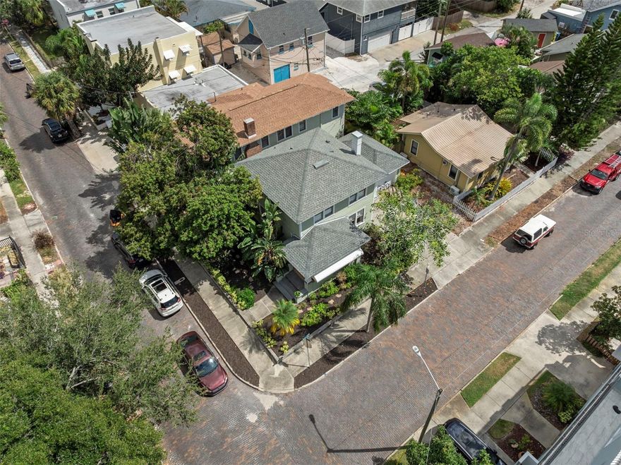Great property for investment or to make your own and have great income producing units. Located in the Historic Uptown and very close to Downtown St Petersburg. There are two buildings located on this tropically landscaped lot. The property consists of a 3 Bed, 1-1/2 Bath stand-alone home in the front that is 1,152 SF. Plus a one car garage with washer and dryer hook up. A beautiful, covered porch with Cuban tile, decorative original hardwood floors, built-ins, pantry, and an outdoor courtyard space located between the 2 buildings. The second building is a duplex. The upper unit (532) is 1,055 SF with 2 or 3 Bedrooms, 1 Bath. It has large living and dining area, Crown molding, and granite counters The Lower Unit (534) is 870 SF with 2 Bedrooms, 1 Bath with an enclosed porch that can be a den or a home office. There are wood floors throughout, granite counters and a claw foot tub. Both units have inside laundry. A great benefit is that a new roof was installed June of 2022 on the back building and a new roof installed on Main house and in December of 2024. This is a tenant occupied property so please do not approach the residence living at the house