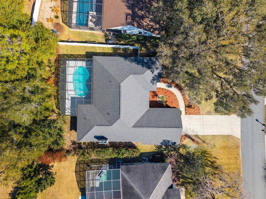 Welcome home to this beautifully updated, move-in-ready pool home ideally located just minutes from charming downtown Mount Dora. Completely Refreshed Pool Home in Park Place on Lake Joanna!. Thoughtfully refreshed from top to bottom, this property offers peace of mind and effortless Florida living with a brand-new roof (2026), new A/C and air handler, fresh interior and exterior paint, new carpet, new ceiling fans and select light fixtures, a new pool pump, and updated outdoor sprinkler system. Designed with both comfort and flexibility in mind, the split-bedroom floor plan begins with a formal living and dining room, highlighted by sliding glass doors that open directly to the screened pool—perfect for indoor-outdoor entertaining. The private primary suite, tucked away on its own wing, features sliding doors to the pool, a spa-like bath with separate shower and garden tub, dual vanities, and two spacious walk-in closets (approximately 5 x 6.3 each). At the heart of the home, the kitchen offers warm wood cabinetry and flows seamlessly into the family room, complete with a wood-burning fireplace, new carpet, and an eat-in nook with sliding doors leading to the pool area. A well-appointed laundry room with a full wall of cabinetry and sink adds everyday convenience. Two additional bedrooms with new carpeting and a full bath are located beyond the laundry room, while a separate guest suite at the rear of the home—complete with its own bathroom and direct pool access—creates the perfect space for visitors or multigenerational living. Step outside to your private retreat: a screened in-ground pool with freshly painted deck, multiple access points, and plenty of room to relax or entertain. The garage offers both interior access and a separate side-yard exit for added functionality. Enjoy community amenities including a playground, private boat ramp, and dock, making it easy to embrace the Eustis/Mount Dora lifestyle—whether boating, strolling downtown shops and dining, or simply relaxing by your pool. Homes this updated, with this floor plan and location, don’t come along often. Schedule your private showing today and see how effortlessly this home fits your lifestyle. All information deemed reliable but must be verified by buyers. All room measurements are approx. and must be also verified by buyers.