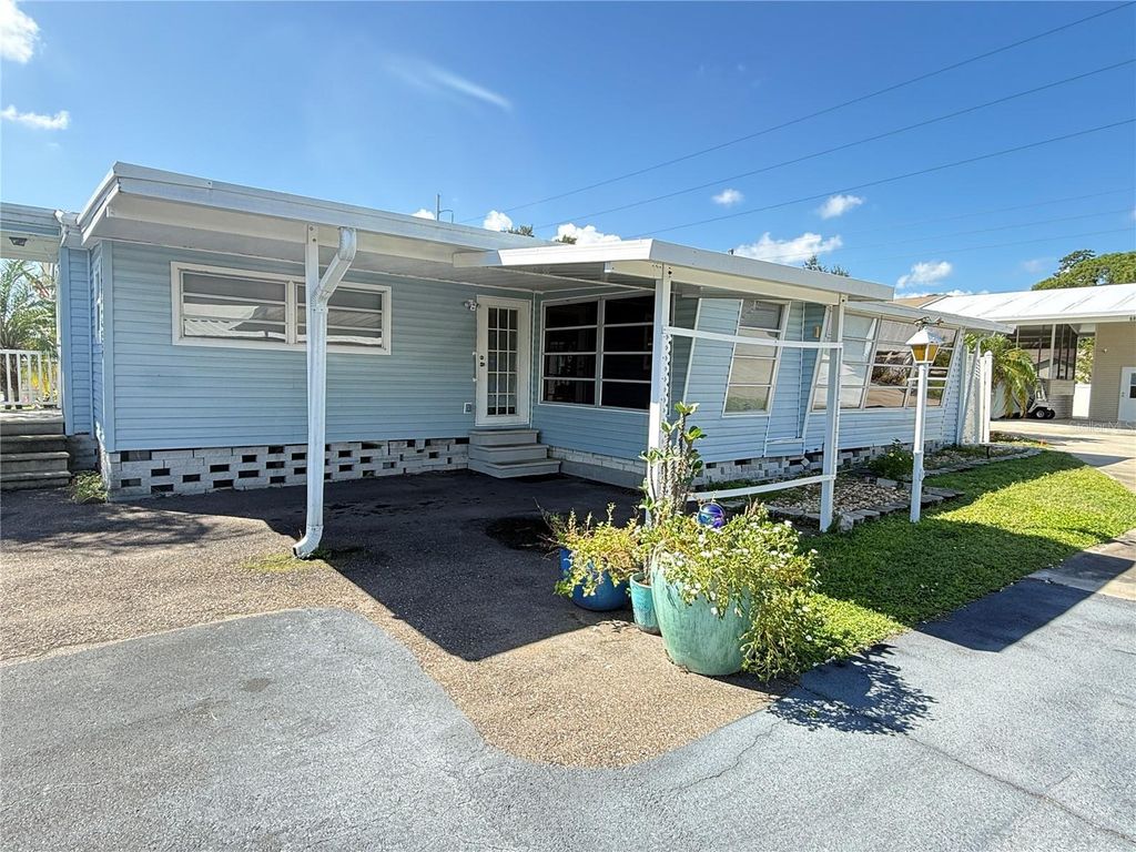 Photo of 6830 Americana Drive NE #127, St Petersburg, FL 33702 (MLS # TB8435944)