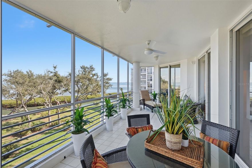 Set within a living canopy of mangroves and coastal trees, this BAYFRONT residence invites a more immersive relationship with Sarasota Bay—where filtered light, birdsong, and gentle water movement define everyday living.

Behind the gates of Bay Isles on Longboat Key, this approximately 3,000-square-foot waterfront residence offers the ease and scale of a single-family home with the security and convenience of condominium living. With three bedrooms and two-and-a-half baths, the layout lives expansively, enhanced by abundant storage and thoughtful separation of living spaces.

Floor-to-ceiling glass sliders in the main living areas and primary suite face east, capturing peaceful sunrise light over Sarasota Bay in a setting best described as park-like waterfront—where mature coastal trees frame the water, creating a serene, private “treehouse” ambiance. Boats glide through the mangrove preserve and lagoon toward open bay waters, accompanied by birdsong and rustling leaves. Two balconies extend the living space outdoors, including a nearly 400 sq ft screened lanai ideal for relaxed coastal living. The primary suite features bay views from bed, terrace access, dual walk-in closets, and a spa-like bath with a freestanding soaking tub, dual vanities, and a glass-enclosed shower.

The second and third bedrooms share access to a west-facing balcony, offering sunset light and cross-breezes.

The kitchen is both functional and social, featuring quartz countertops, a Sub-Zero refrigerator, generous prep space, a built-in desk nook, mini-fridge and wet bar—well suited for entertaining or casual mornings. A dedicated walk-in laundry room adds practicality with a butcher-block workspace, hutch, and tool cubby.

Comfort and peace of mind are prioritized with two A/C zones, new condensers (2025), and two hot water tanks (2021) equipped with a flood-stop device. Brand new carpet and paint. 

Additional highlights include air-conditioned storage, one assigned garage parking space, and exceptional closet capacity—five linen closets, three pantry closets, and three walk-in closets.

Residents enjoy on-site management, a fitness center, library, tennis and pickleball courts, a heated resort-style pool, car washing area, and EV charging stations. The building features a brand-new roof completed in 2025.  Pet-friendly.

The location is as compelling as the home itself: secure, serene, and walkable. Adjacent to the Longboat Key Club Marina, and just blocks from Publix, CVS, the post office, and banking, this location allows for a genuinely walkable daily rhythm—rare on Longboat Key.

As part of Bay Isles, residents also enjoy access to the Bay Isles Beach Club, a private Gulf-front retreat with gated parking, pavilions, grilling areas, restrooms, and seating for sunset views. Deeded beach access ensures a premier spot on the sand. Membership to the nearby Longboat Key Club is available, offering championship golf, world-class tennis, a full-service spa and wellness center, waterfront dining, and deep-water marina access.