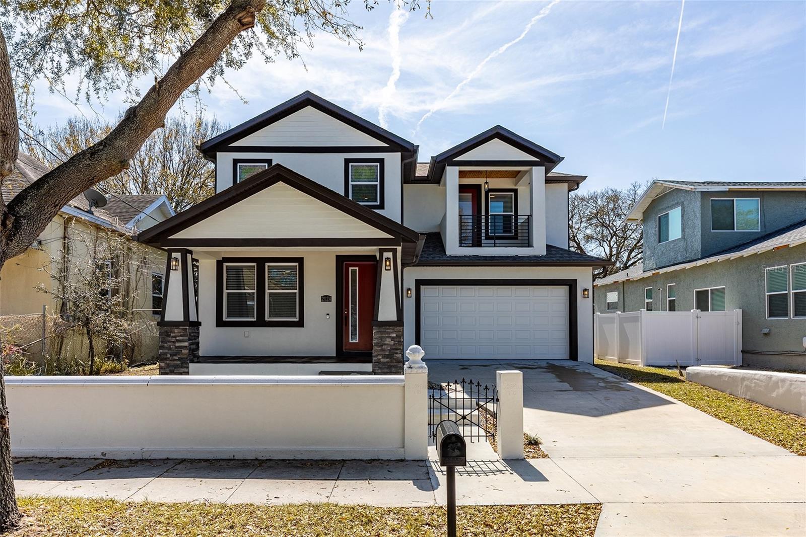 Contemporary Traditional-Style Single-Family Home in MidTown Tampa near University of Tampa! This Beautiful Newly Constructed Home BOASTS: 4 Bedrooms, 3 Full-Bathrooms, 2+ Car Garage, 8ft Doors, High Ceilings, Wood Moldings, Wood-BeadBoard-Ceilings at Balcony, Lanai and Front Porch, No Carpet and a Large Fully-Fenced Yard! The Gourmet Kitchen is an Absolute Chef's Delight, Featuring: Expansive Quartz Countertops, Huge Island, 42" Wood Cabinets w/Soft-close hinges, Custom Pendant Lights and All Stainless-Steel Appliances! The Spacious Primary-Suite Offers a Private Balcony, Tray-Ceiling with Crown Molding, 2 Huge Walk-In Closets and SPA-Like Primary Bathroom with Quartz Dual-Sink Vanity, Garden-Tub and a Separate 6ft Glass and Tiled Shower! All 4 Bedrooms are generously sized with ample closet space! In-Addition to the Spacious Open-Layout, Parking, Outdoor Areas, Fenced Yard, Garage, Storage, Upgrades, Etc.... this house comes complete with an Upstairs Laundry Room complete with Samsung Washer, Dryer and Utility-Sink! This home is Perfect For Entertaining and the Ultra-Convenient LOCATION off of Howard Ave. is Close To Everything: University of Tampa, RIVERWALK, SoHo, Downtown, Airport, Hyde Park Village, MidTown, International Mall, Westshore Mall, Bayshore Blvd., MacDill AFB, Rocky Pointe, St. Pete, Clearwater, Ybor City, Straz Center, Moffitt, TGH, St. Joseph's Hospital, Busch Gardens, i275, i75, i4 and So Much More!