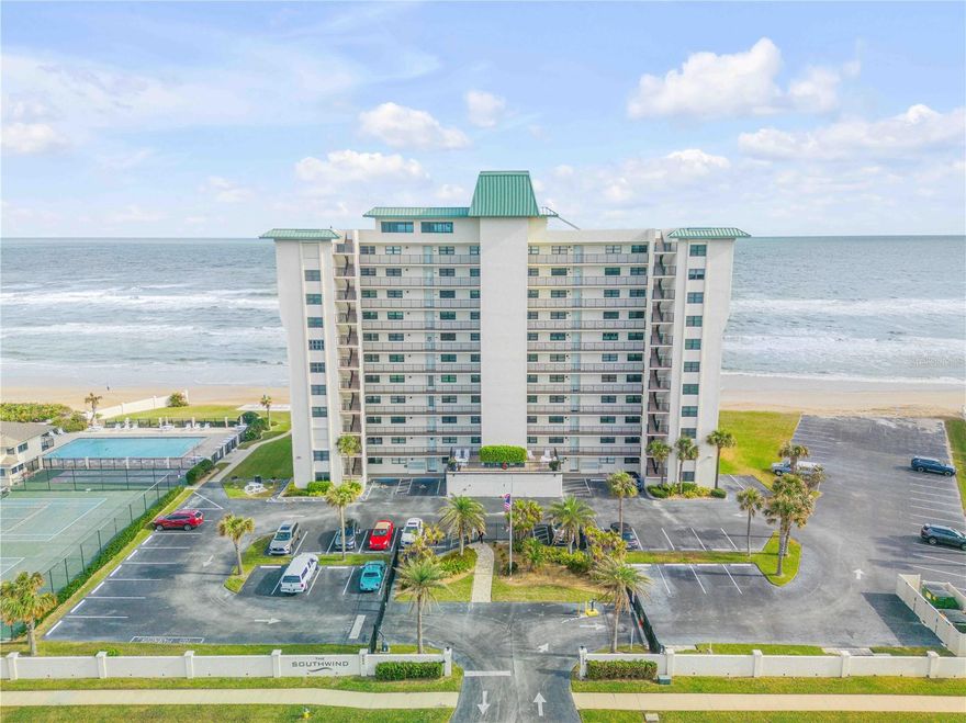 Located along the pristine no-drive shores of New Smyrna Beach, this beautifully renovated and fully furnished two bedroom, two bath condo home offers an exceptional blend of comfort, convenience, and coastal lifestyle. Situated within the oceanfront gated community of The Southwind, this coastal retreat is in one of the area’s most sought-after locations. This residence showcases breathtaking unobstructed views of the Atlantic Ocean to the east, and the Intracoastal Waterway to the west. Stunning sunrises and tranquil sunsets are the norm, with the bonus of incredible day and night launches viewing coming from Cape Canaveral.

The kitchen features a custom sculpted granite island top, as well as quartz countertops, stainless steel appliances, and custom wood cabinetry offering plenty of storage and style. The open-concept kitchen and living areas flow seamlessly, making it perfect for entertaining or ultimate relaxation.

The two bathrooms have been elegantly upgraded with granite countertops, glass tiles, and custom cabinetry. Porcelain tile with wood grain runs throughout the home. Upgraded PGT high-performance sliding glass doors and oceanfront windows installed in 2022, along with automatic hurricane shutters, provide peace of mind and added storm protection. Custom window treatments throughout include plantation shutters and custom woven shades.

Southwind amenities include a beachside pool (heated seasonally), Year 2025 pickleball and tennis courts, shuffleboard and basketball, and a beautiful rooftop owners lounge. A Structural Integrity Reserve Study and Milestone Inspection report have been completed, ensuring this is a safe and sound investment.

Ideal as a primary residence, serene vacation getaway, or lucrative rental opportunity, this property delivers luxury beachfront living at its finest.