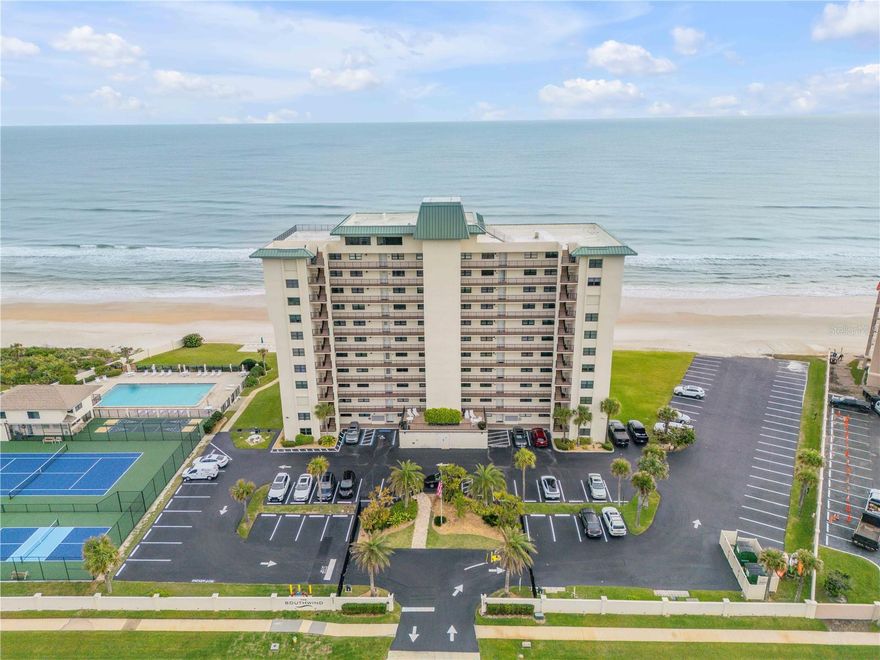 Located along the pristine no-drive shores of New Smyrna Beach, this beautifully renovated and fully furnished two bedroom, two bath condo home offers an exceptional blend of comfort, convenience, and coastal lifestyle. Situated within the oceanfront gated community of The Southwind, this coastal retreat is in one of the area’s most sought-after locations. This residence showcases breathtaking unobstructed views of the Atlantic Ocean to the east, and the Intracoastal Waterway to the west. Stunning sunrises and tranquil sunsets are the norm, with the bonus of incredible day and night launches viewing coming from Cape Canaveral.

The kitchen features a custom sculpted granite island top, as well as quartz countertops, stainless steel appliances, and custom wood cabinetry offering plenty of storage and style. The open-concept kitchen and living areas flow seamlessly, making it perfect for entertaining or ultimate relaxation.

The two bathrooms have been elegantly upgraded with granite countertops, glass tiles, and custom cabinetry. Porcelain tile with wood grain runs throughout the home. Upgraded PGT high-performance sliding glass doors and oceanfront windows installed in 2022, along with automatic hurricane shutters, provide peace of mind and added storm protection. Custom window treatments throughout include plantation shutters and custom woven shades.

Southwind amenities include a beachside pool (heated seasonally), Year 2025 pickleball and tennis courts, shuffleboard and basketball, and a beautiful rooftop owners lounge. A Structural Integrity Reserve Study and Milestone Inspection report have been completed, ensuring this is a safe and sound investment.

Ideal as a primary residence, serene vacation getaway, or lucrative rental opportunity, this property delivers luxury beachfront living at its finest.