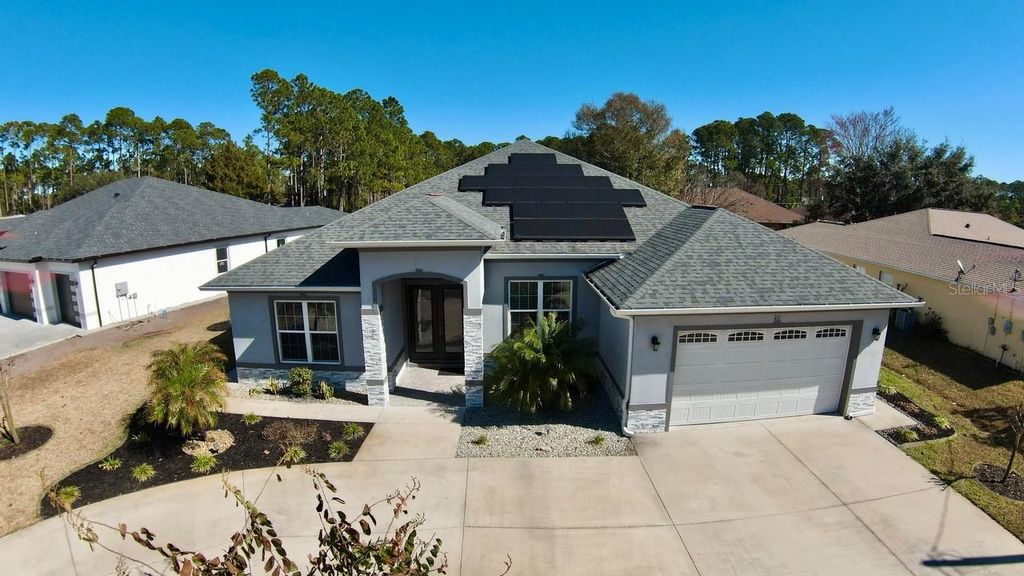 Photo of 20 Lake Success Drive, Palm Coast, FL 32137 (MLS # FC315704)