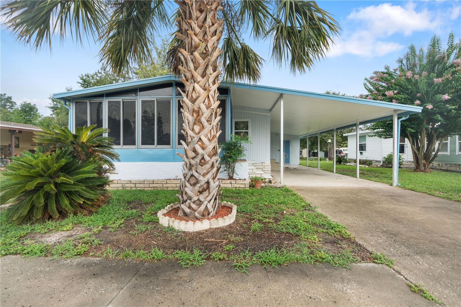 Welcome to this completely remodeled and fully furnished 2 bedroom 2 bathroom home in the Park of Lake Marinette/Cypress Village. You own the land and a super low $84/month HOA fee. Enjoy the community pool, clubhouse and all the activities! Walking into this home you find the kitchen with butcher block countertops, corian sink and all new cabinetry. There is a brand New refrigerator and all stainless steel appliances. There is a dinning area to the left and an open family room. The home has all new laminate flooring,blinds and double pane single hung windows! Both bathrooms have been remodeled with New Tub, New Shower, medicine cabinets and New fixtures! New CPVC plumbing through out the entire house and a NEW Water Heater! Brand New Well Pump and fully operating irrigation system. All new LED light fixtures through out. The front of the home has a wonderful lanai with updated sliders. The home has 2 sheds for storage, a covered carport and the electric panel has been updated. Get to this home fast, they do not come on the market very often!