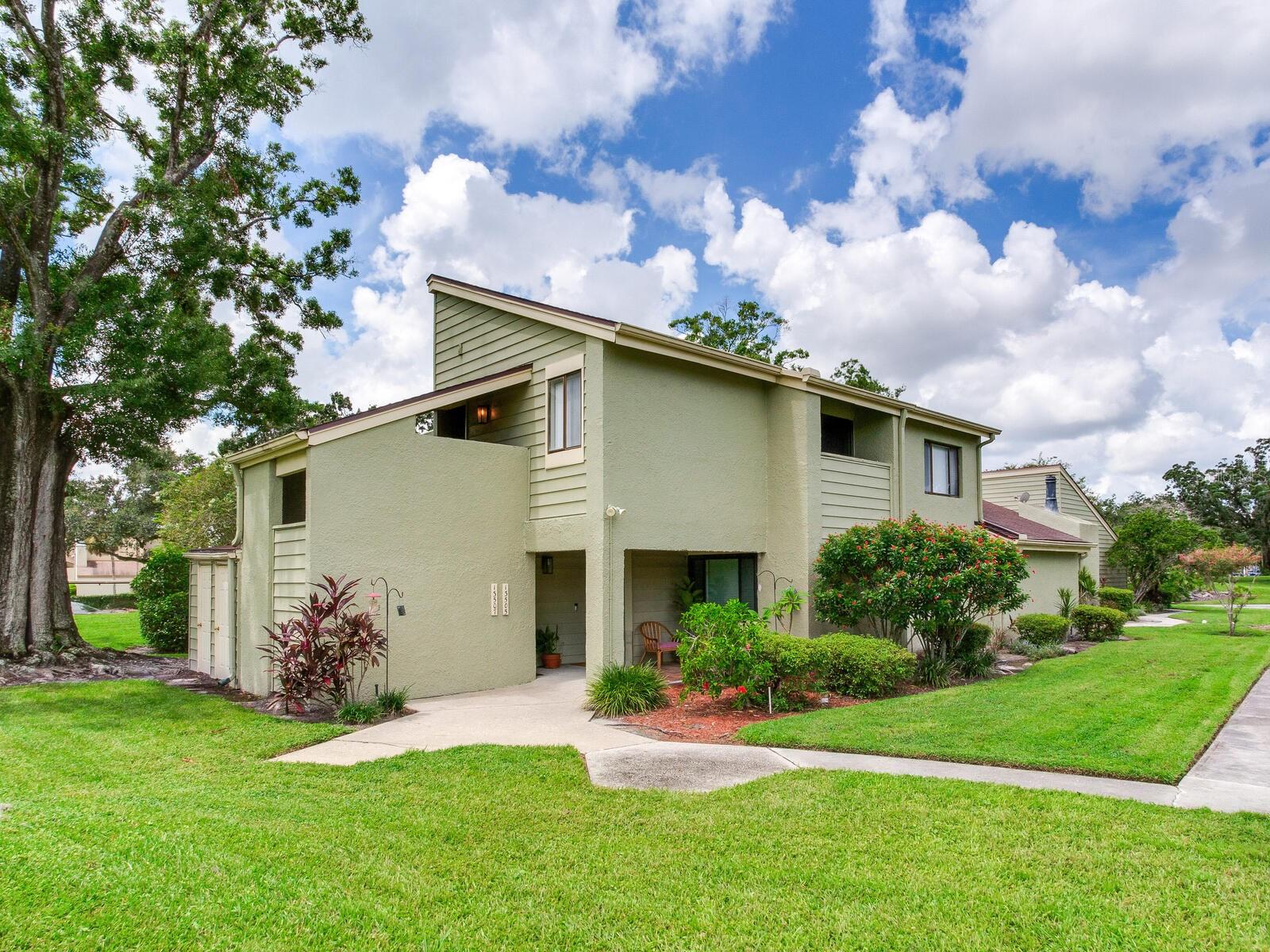 LOCATION, LOCATION, LOCATION! Rarely available corner-unit in Village Green at Carrollwood Village. This 2-bedroom, 1.5-bath home features a bright, open floor plan with vaulted ceilings, hardwood and an electric fireplace. Sliding doors lead to a private patio, while the flexible dining/office space—converted from a patio into heated/cooled square footage—adds versatility.
The kitchen offers plenty of storage, a large pantry, and a breakfast bar that opens to the living area. The split bedroom plan provides privacy, with the spacious primary suite including an ensuite bath and updated glass shower. A convenient laundry closet is located just off the kitchen.
Recent updates include a brand new 2.5-ton HVAC system, newer hardwood flooring, and a roof replaced in 2017. A private ground-level storage room is also included.
All of this in the heart of Carrollwood Village—just steps from Publix, shopping, restaurants, and entertainment, with nearby access to Carrollwood Village Park, the Cultural Center, Vista Gardens, and Carrollwood Country Club.