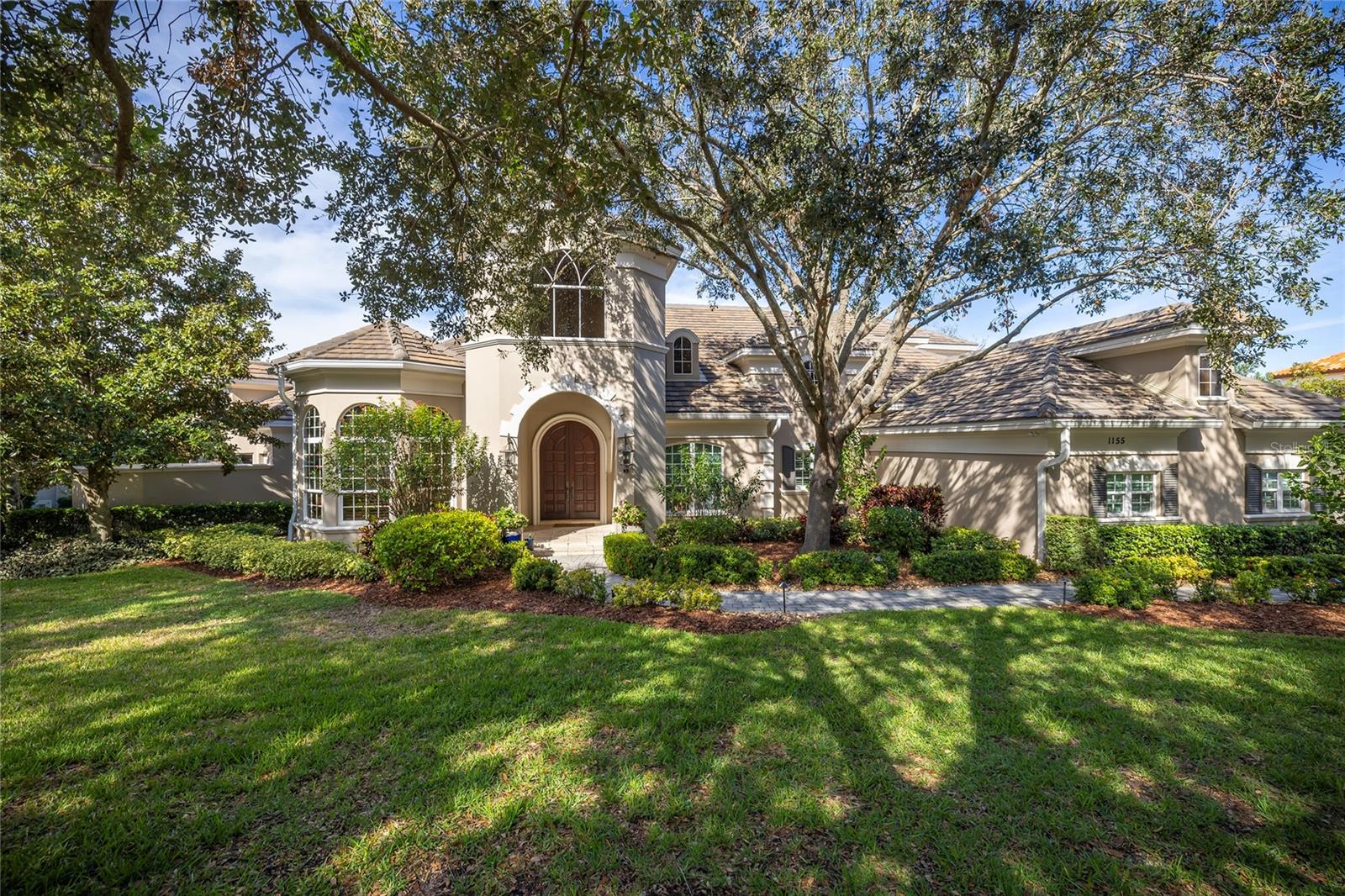 Unparalleled recreational amenities define this home overlooking the Osprey Golf Course at Innisbrook Golf Resort. Enjoy views of forever green fairways and postcard sunsets while entertaining guests by the infinity-edge pool and spa. NOT in a flood zone. The impressive theater/game room houses a glass front wine cellar, holding approximately 1500 bottles of wine. This 5 bedroom, 4 full baths, 1 half bath plus office home boasts a new kitchen in 2022 and a new roof in 2020. The 5th bedroom/second office is on the first floor with a small closet. Set on a half acre lot, this home looks majestic. The grand foyer steps down to the casual elegance of the living room and dining room with Butler’s Pantry. The new island kitchen with white cabinets, stone countertops, Wolf gas cooktop, Wolf double ovens, and Sub Zero refrigerator will make cooking a joy. The kitchen opens to the breakfast dining and family room. Tray ceilings, crown molding, tumbled marble floors, and plantation shutters adorn this home. The first-floor primary suite boasts a sitting area, two private bathrooms, two large walk-in closets, a shared shower, and a private outdoor heated spa. The 10-seat theater with 2021 cinema system including a cocktail bar, poker table, wet bar, and glass front full wall wine cellar is a winning combination. On the second floor, there are 3 guest bedrooms with walk-in closets. Central vacuum. Designed with space for an elevator to be added. The salt-chlorinated, heated infinity pool with spillover spa was renovated in 2021. The outdoor kitchen is complete with gas grill, fireplace, beverage refrigerator, and is framed in stonework with a milled-work ceiling. New sprinkler system in 2021 with reclaimed water for irrigation, and landscape refresh. Insta-heat water heater 2021 and Culligan water system. Side load three car garage. Discounted full golf membership available to buyer. Social membership to Innisbrook Golf Resort is required ($1,541) including use of the Loch Ness resort pool with waterslides, additional heated pools, fitness center, golf driving range, and access to a full-service spa. Additional memberships available for tennis, pickleball, golf courses, and racquetball. Minutes to beautiful beaches. Community is across the street from the 45 mile Pinellas biking/walking trail and Wall Springs Park. Location! Location!