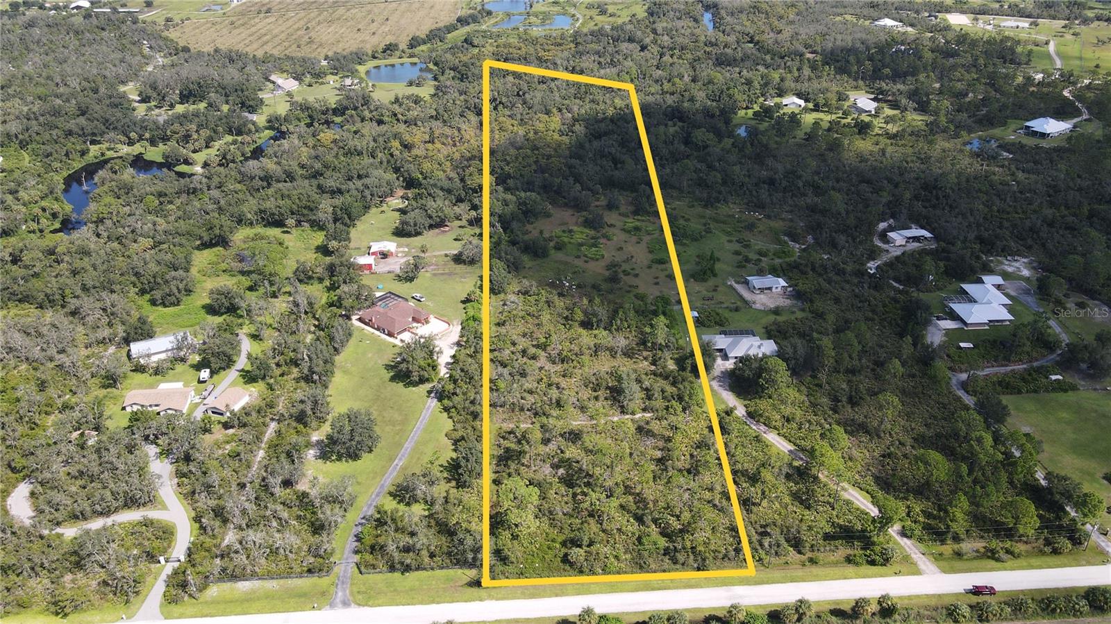 5+ acres in a serene equestrian community, surrounded by a large nature preserve.
Enjoy a navigable creek, trails for hiking, biking and 33 miles for horseback riding. An Agricultural Exemption for bees helps lower property taxes. There are protected species here; Gopher tortoises, Caracara (one breeding pair of Caracara have 2 babies each year). The annual bird migration brings Painted Buntings, Indigo Buntings, Goldfinches and many more varieties. You will also see the occasional Bobcat and, while not endangered, the neighborhood is protective of them. The ideal buyer will be environmentally conscious, love outdoor activities, nature, woods and native plants. Build your forever home on this rare and amazing property.