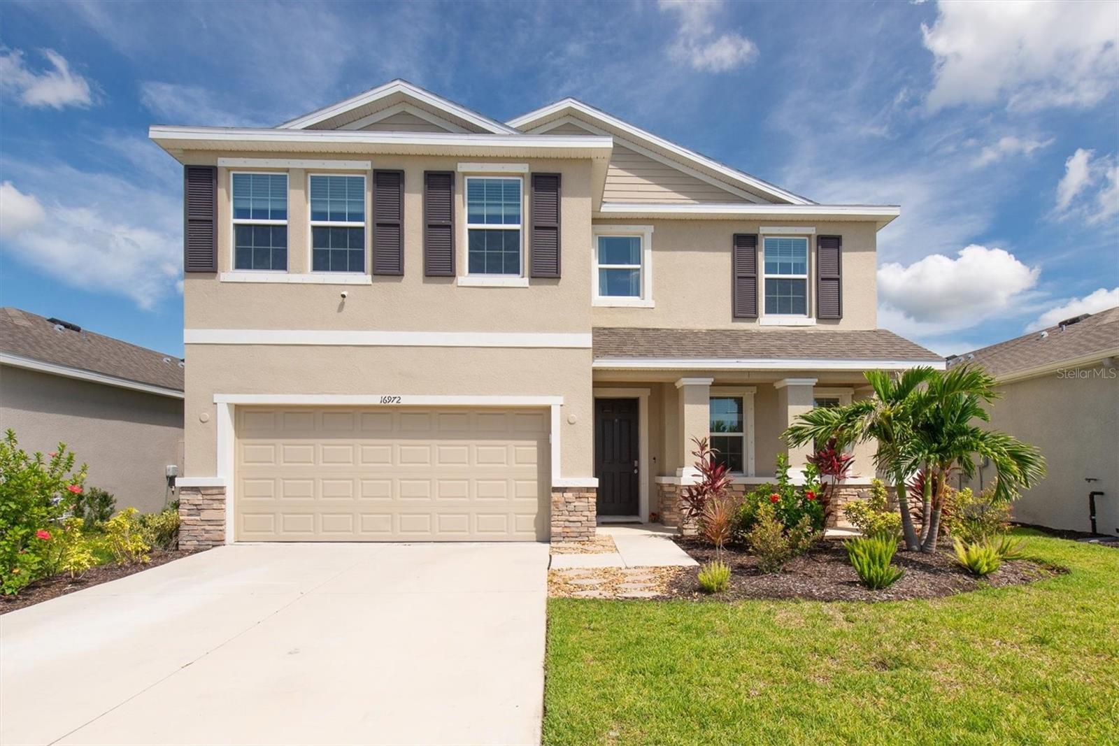 Enjoy RESORT STYLE LIVING in the established GATED COMMUNITY of Southshore Bay! Built in 2022, you will find all the newer benefits of comfort and fun! Presenting FOUR BEDROOMS and THREE FULL BATHS, this two-story concrete block home welcomes you to nearly 2,800 sq feet of GORGEOUS open concept living perfect for any lifestyle! Step into the oversized foyer to find tall ceilings and a bright and airy design. The kitchen is well-appointed with GRANITE COUNTEROPS, COMPLETE STAINLESS STEEL APPLIANCE PACKAGE, and a generous island and breakfast bar opening to the large dining area and panoramic view. The thoughtfully designed layout allows for the GREAT ROOM to flow naturally from the kitchen and dining area, making this an easily functional space. The front bonus room is perfect for an office / study or a formal living space. A true split floor plan, this home is suitable for a variety of living or guest arrangements. The large primary retreat with WALK IN CLOSET and tons of natural light also offers a primary EN-SUITE with dual sinks, tall countertops, walk-in shower, and a GARDEN TUB. Also located on the second floor are the spacious 2nd and 3rd bedrooms with separate laundry room for added convenience. The GIANT LOFT is excellent for a student study area, game or media space! The 4th bedroom is located on the main floor easily accommodating extra privacy for guests or second generational living. The outdoor living possibilities are endless here! Situated on a PREMIUM LOT WITH NO REAR NEIGHBORS, you will find extra space on either side. With tons of EXTRAS, this home also comes equipped with an automated SMART HOME package and is in a ULTRAFi community hosting ultra-speed Wi-Fi throughout. CABLE AND INTERNET ARE INCLUDED IN THE LOW HOA FEE, reducing your monthly bills even MORE! Southshore Bay residents can take advantage of the paradise-like neighborhood featuring the world’s top amenity: a multi-acre CRYSTAL LAGOON with a swim-up bar and restaurant for endless fun that lets you live like you are on vacation! Cabanas, sandy beach areas, a playground, dog park, zen garden, walking trails, golf cart paths and more! Meet friends and neighbors easily at one of the many community events and celebrations. Commuting is easy with access to major roads and highways. Downtown Tampa is less than 30 minutes away while Tampa International Airport, highly esteemed colleges and universities, a newly built VA Medical Center, state-of-the-art health care, world-champion sports leagues, magical theme parks and world-famous beaches, museums and nature preserves are all just an easy car ride away. Take advantage of this Florida lifestyle now!