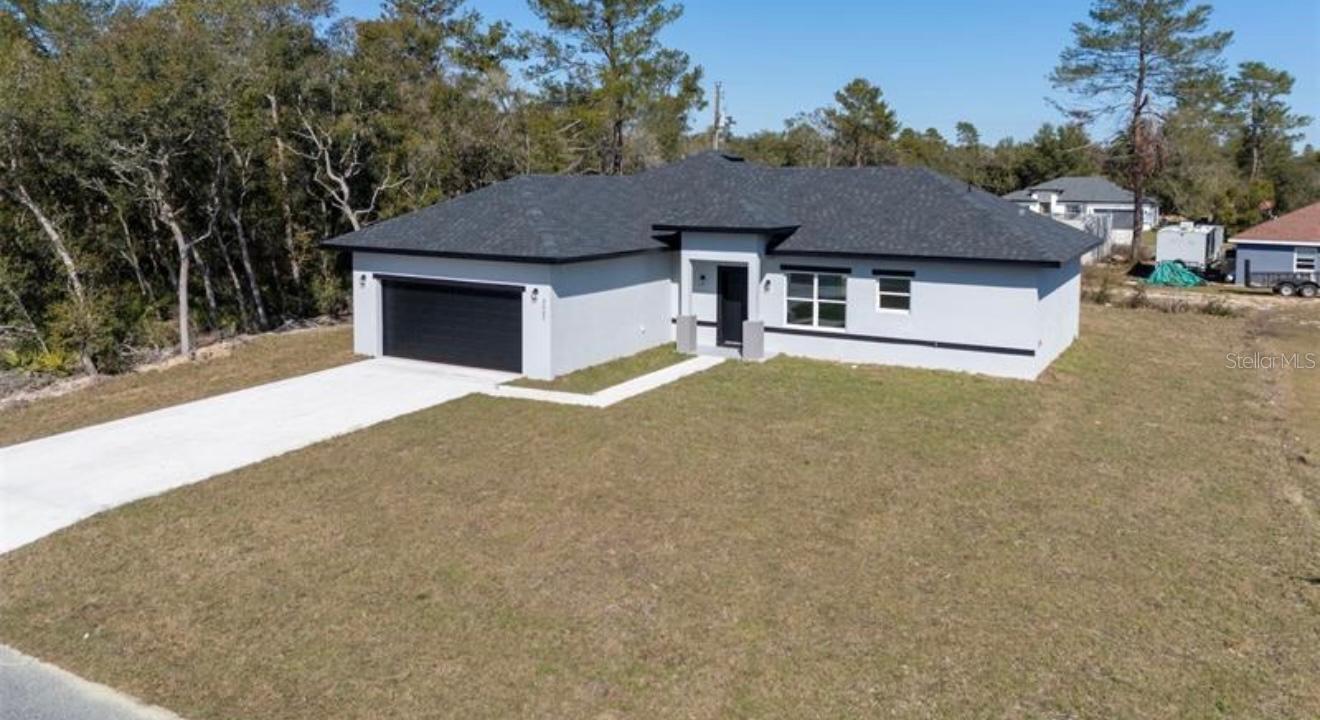 Step into this stunning Siena model home, a showcase of modern living right here in Marion Oaks. With 4 spacious bedrooms and 2 full baths, this home blends comfort, functionality, and contemporary style in all the right ways. From the moment you walk in, the open floor plan invites you to relax or entertain with ease. The flow from the kitchen to the living area creates the perfect space for family gatherings, casual dinners, or quiet nights in. And with luxury vinyl plank flooring throughout, there’s no carpet, easy-to-maintain floors that keep life simple.
The kitchen steals the show with high European-style cabinets and quartz countertops, sleek, modern, and right on trend. It’s a space that feels high-end. Step outside to the covered lanai and you’ll see why this home is built for real living, perfect for Sunday BBQs, birthdays, or just sipping your morning coffee. Built with solid block cement, this home offers lasting quality and peace of mind. It’s modern, stylish, and ready for its first homeowner to make it theirs.