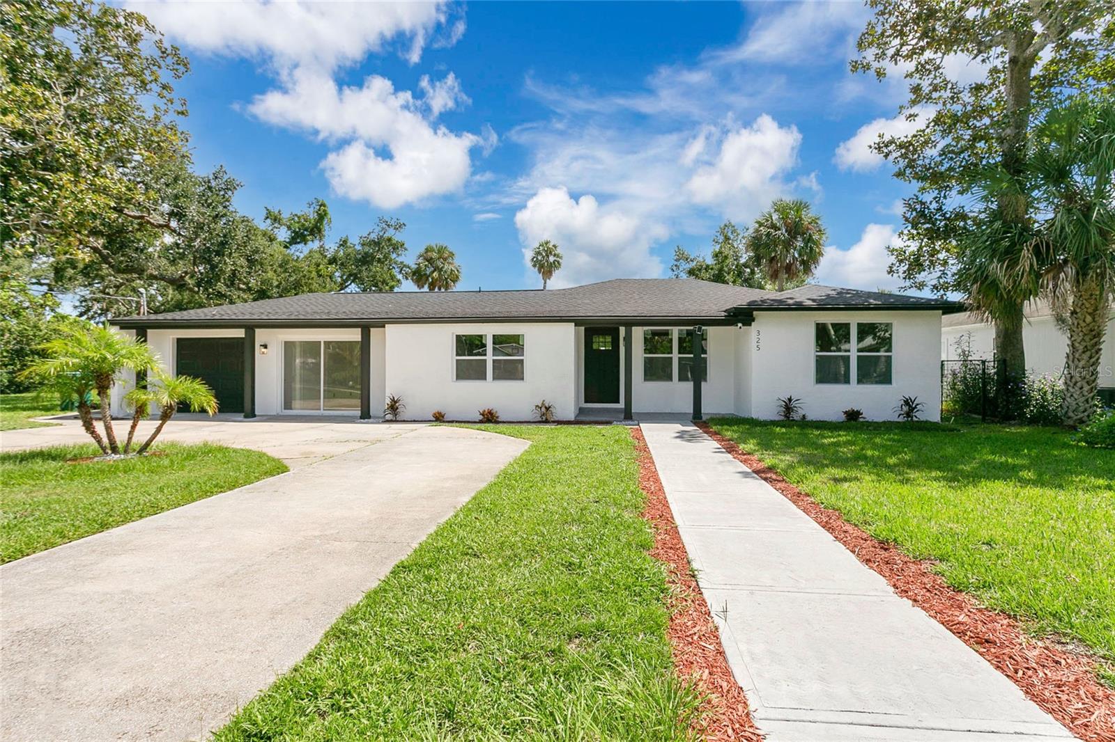 This property is a unique blend of comfort, convenience, and investment potential. Whether you're looking for your next family home or a high-demand short-term rental property, this house has it all. Imagine living or generating income just minutes from the river and the ocean, with access to a wide variety of recreational activities.
This location is excellent for those who appreciate top-tier convenience and entertainment. Get your adrenaline fix at the world-famous Daytona International Speedway, find great deals at the Tanger Outlets mall, or enjoy a day out at the local parks and boat docks. For golf enthusiasts, the property is conveniently located near the Daytona Beach Golf & Country Club, renowned for hosting major tournaments on its historic courses. Plus, its proximity to the Daytona Beach International Airport makes travel exceptionally easy.
The property sits on a 17,500 ft2 lot, has 3,108 ft2 of building, with a backyard perfect for parking your recreational vehicles. It features lateral access that lets you easily accommodate and park your RV, boats, motorcycles, and electric carts. A bonus is a private water well, which provides free water for irrigation and other activities, resulting in significant savings.
This single-story home has been recently renovated for your family's enjoyment. It includes a 330 ft2 renovated Bonus Room, all bathrooms have been completely remodeled with modern finishes, and the kitchen shines with smart stainless-steel appliances to make daily life a breeze.
The property features a new roof, new impact-resistant windows, and a new AC unit. The waterproof vinyl flooring throughout the house offers durability and a clean, stylish look. The home also includes a fireplace that, with a bit of restoration, can become the perfect focal point for cozy evenings. The interior layout offers the perfect opportunity to create a complete in-law suite with its own private entrance, providing the privacy and independence you and your family deserve.
This is the opportunity you've been waiting for! Don't miss out on acquiring a home with an excellent location, ample space, and incredible potential.