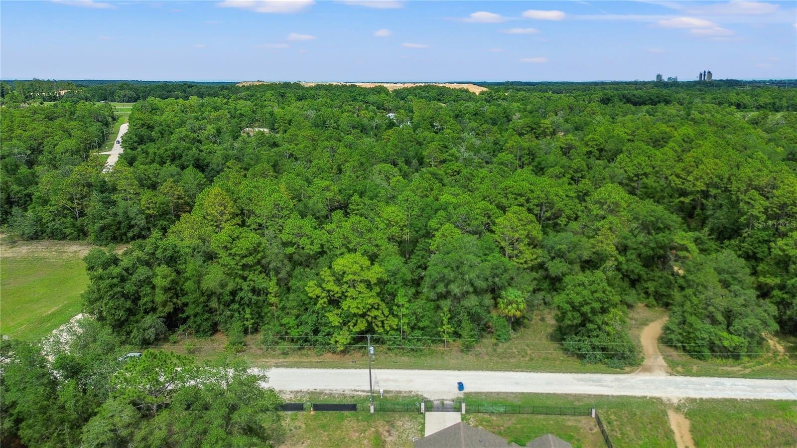 Discover the perfect opportunity to create your custom oasis on this spacious **half-acre vacant lot** in the desirable **Royal Highlands** community. Nestled in a serene, natural setting with **no HOA restrictions**, this property offers the ideal blend of privacy, space, and convenience. With **plenty of room for a large home, pool, or workshop**, and surrounded by Florida's natural beauty, this lot is ready for your vision. Enjoy the peace and quiet of country living while being just minutes from shopping, dining, and major highways. Located near the world-famous **Weeki Wachee Springs State Park**, you'll be close to crystal-clear natural springs, kayaking adventures on the Weeki Wachee River, and the legendary live mermaid shows. Whether you enjoy boating, fishing, or simply exploring Florida's untouched landscapes, this area is a nature lovers paradise! Imagine the possibilities — your dream home starts here!