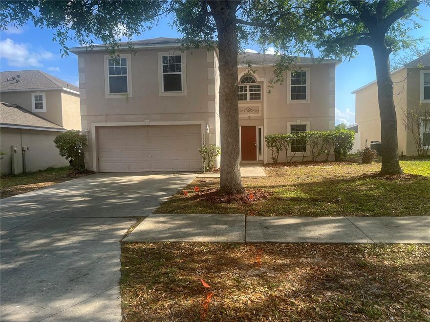 Beautiful 4 Bedroom 2.5 Bathroom Home on Located in the Quiet Overlook at Lake Griffin Community. Open floorplan with tile and carpet floors throughout the first floor. A formal dining room and family room which is perfect for entertaining. The kitchen features an island with wood cabinets and appliances including a refrigerator, dishwasher and microwave. Primary bedroom suite is huge featuring a walk-in closet and a private bathroom featuring dual sinks, stone countertops with a separate garden tub and shower. Exterior patio area is large enough to host friends and family while the fenced yard provides plenty of space for the pets to play. The location is perfect just minutes from all daily necessities including shopping, entertainment, restaurants, schools, Downtown Leesburg, Route 441/27 and expressways to Orlando. The community has sidewalks and streetlights which provides you a great opportunity to see and be safe within the community at night. Please call to schedule a showing today!