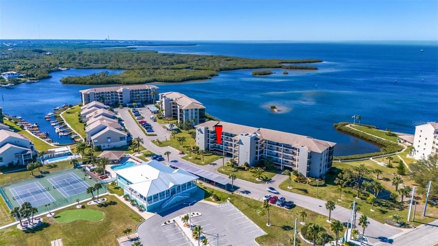 BEAUTIFULLY UPDATED, MOVE-IN READY, PARTIALLY FURNISHED condo...Immediately start enjoying the STUNNING, PANORAMIC, UNOBSTRUCTED VIEWS OF THE GULF in the EXCLUSIVE, GATED Sand Pebble Community! Enjoy BEAUTIFUL SUNSETS from this COMPLETELY REMODELED Unit with TONS OF NATURAL LIGHT + WOOD-LIKE TILE throughout! GOURMET KITCHEN with PLENTY OF COUNTER SPACE and STORAGE! LIVING ROOM with AMAZING VIEWS! LARGE PRIMARY BEDROOM with MORE VIEWS + SPA-LIKE PRIMARY BATHROOM...dual sinks, HUGE shower, & WALK-IN CLOSET with BUILT-INS + IN-WALL SAFE! Guest Bedroom with conveniently located and UPDATED guest bathroom! STUDY/DEN with CEILING TO FLOOR WINDOWS for the PERFECT VIEW of the GULF OF MEXICO! INSIDE LAUNDRY! Unit comes with ONE ASSIGNED CARPORT PARKING SPOT + STORAGE CLOSET. ELEVATOR in BUILDING! AMAZING COMMUNITY incudes: TWO HEATED SWIMMING POOLS + 24-HOUR GUARD GATE + COMMUNITY BOAT RAMP + PUTTING GREEN + TENNIS COURTS + NEW Clubhouse with FITNESS CENTER, Full KITCHEN, LIBRARY, Game Room with PING PONG & POOL TABLES! Come enjoy the Florida lifestyle! Schedule your private showing today!