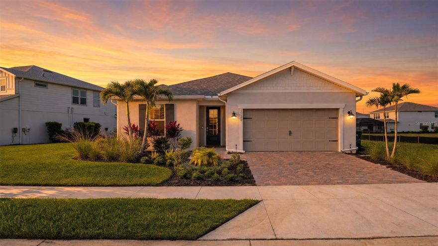 Every evening, the sun dips over the lake and paints the sky in gold — and from this west-facing Northridge home, you have a front-row seat. This meticulously upgraded 3-bedroom, 2-bath home in Babcock Ranch delivers the Florida lifestyle in full: a custom saltwater heated pool with elegant swan water features, an extended lanai with automated blinds and extra sliders from the dining room, and privacy hedging around the pool sides so your outdoor retreat is truly your own. Step inside and the craftsmanship is immediately evident. Zero corner sliders open the great room to the outdoors, while board and batten accent walls and a designer feature wall add architectural character rarely found at this price point. The built-in kitchen package anchors the heart of the home with a gas cooktop, herringbone backsplash, and a whole-house water filtration system with a dedicated drinking water spout at the island. Luxury vinyl plank runs throughout — not a square foot of carpet — and plantation shutters dress every room. The primary suite features a spa-style shower with tile carried all the way to the ceiling. Automated window coverings on the sliding doors and front door, plus manual blinds on the lanai side, mean every level of light and privacy is at your fingertips. Practical upgrades round it out: impact windows and doors, a deep tandem garage, a whole-house water filtration system, and an electric pool heater that keeps operating costs predictable year-round. Location within Babcock Ranch doesn't get much more convenient than Northridge — just minutes from Founders Square, Yellow Pine, and Crescent B Commons, with one of the easiest exits out of the community for commutes and day trips. And then there's Babcock Ranch itself: America's first solar-powered town, built for everyone. Whether you're a young family, a remote worker, an active retiree, or simply someone who wants to live somewhere intentionally designed for a great life — Babcock Ranch has a place for you.